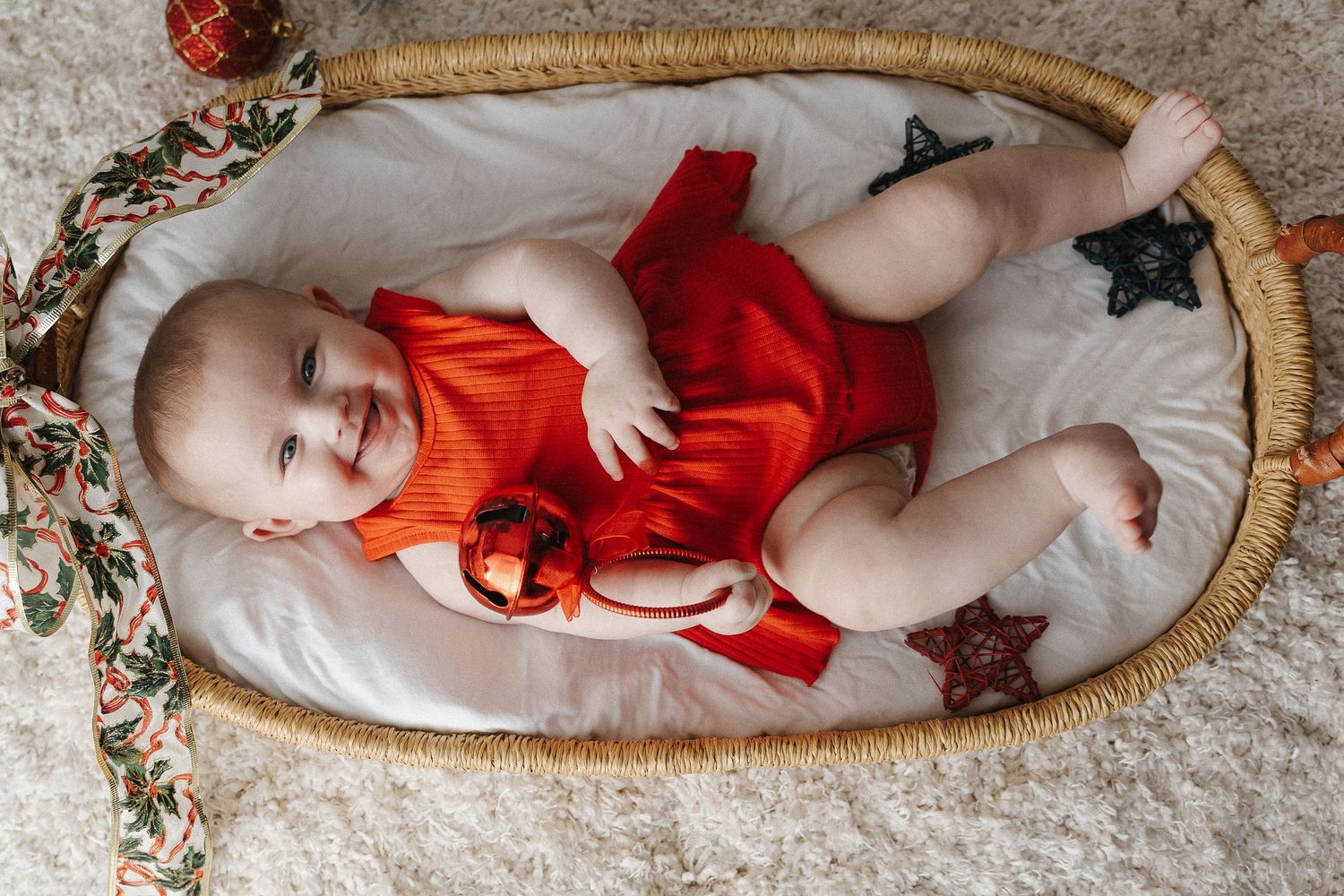 A laughing baby in Canberra Christmas mini photoshoot