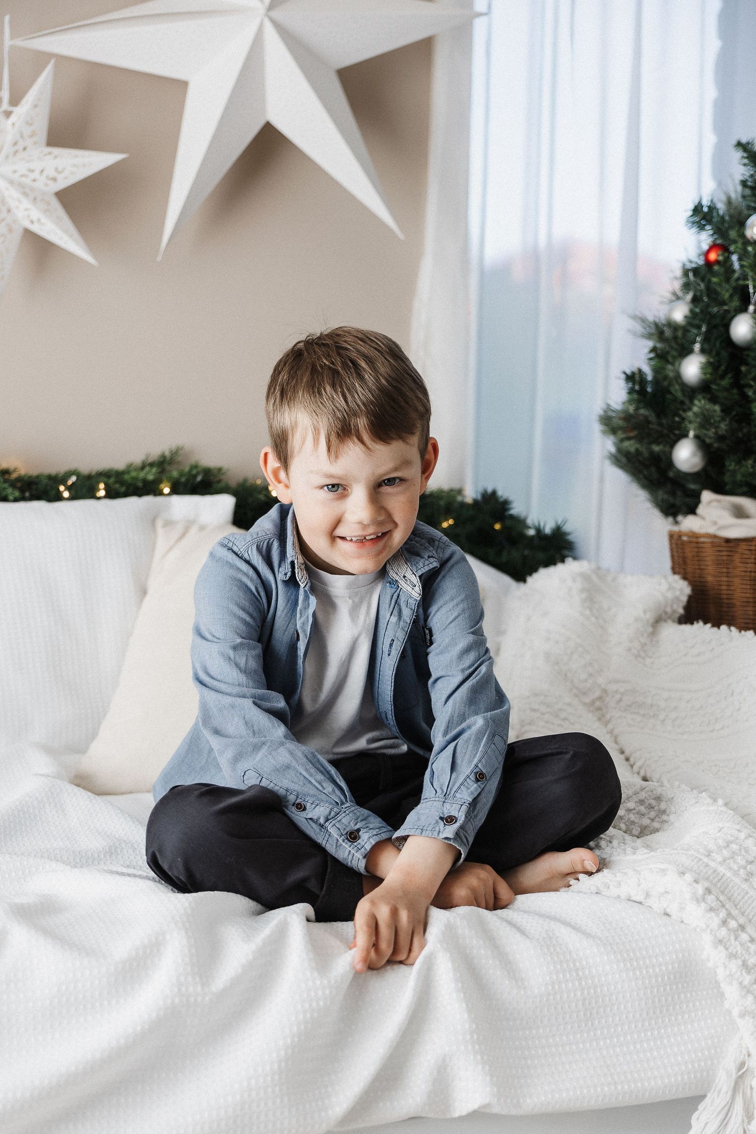 Boy smiling in Christmas scene during mini photo shoot in Canberra