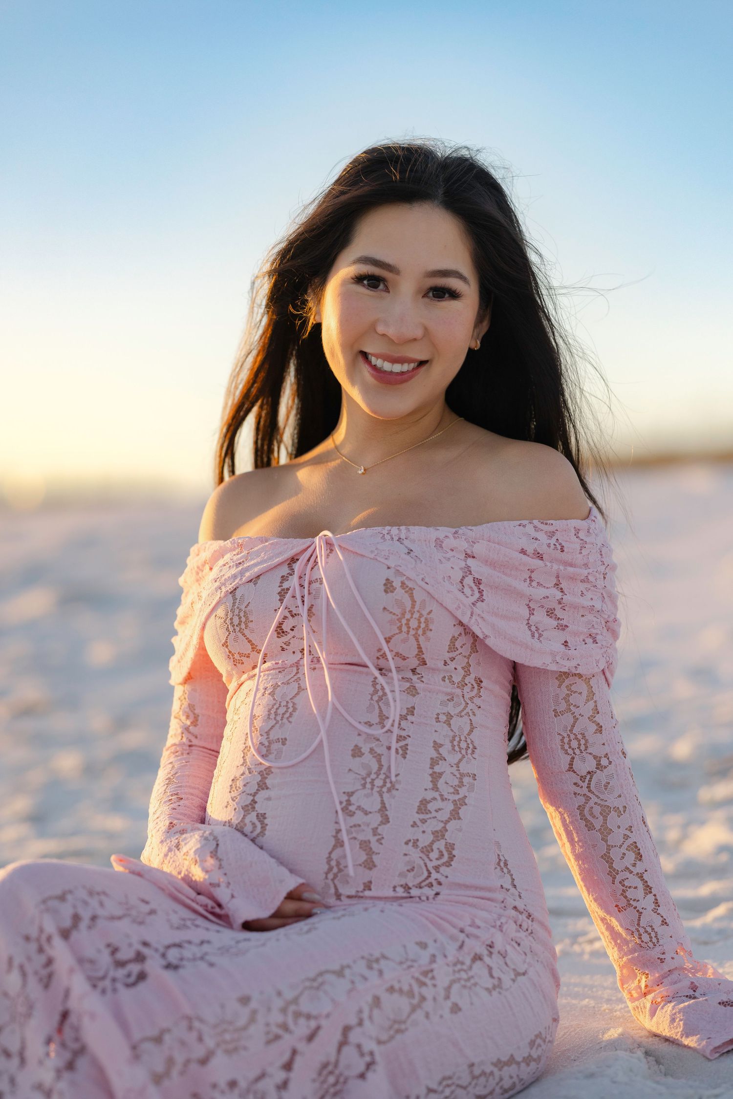 A series of beach portraits showing a figure in a pink lace dress at sunset with soft lighting and sandy backdrop.