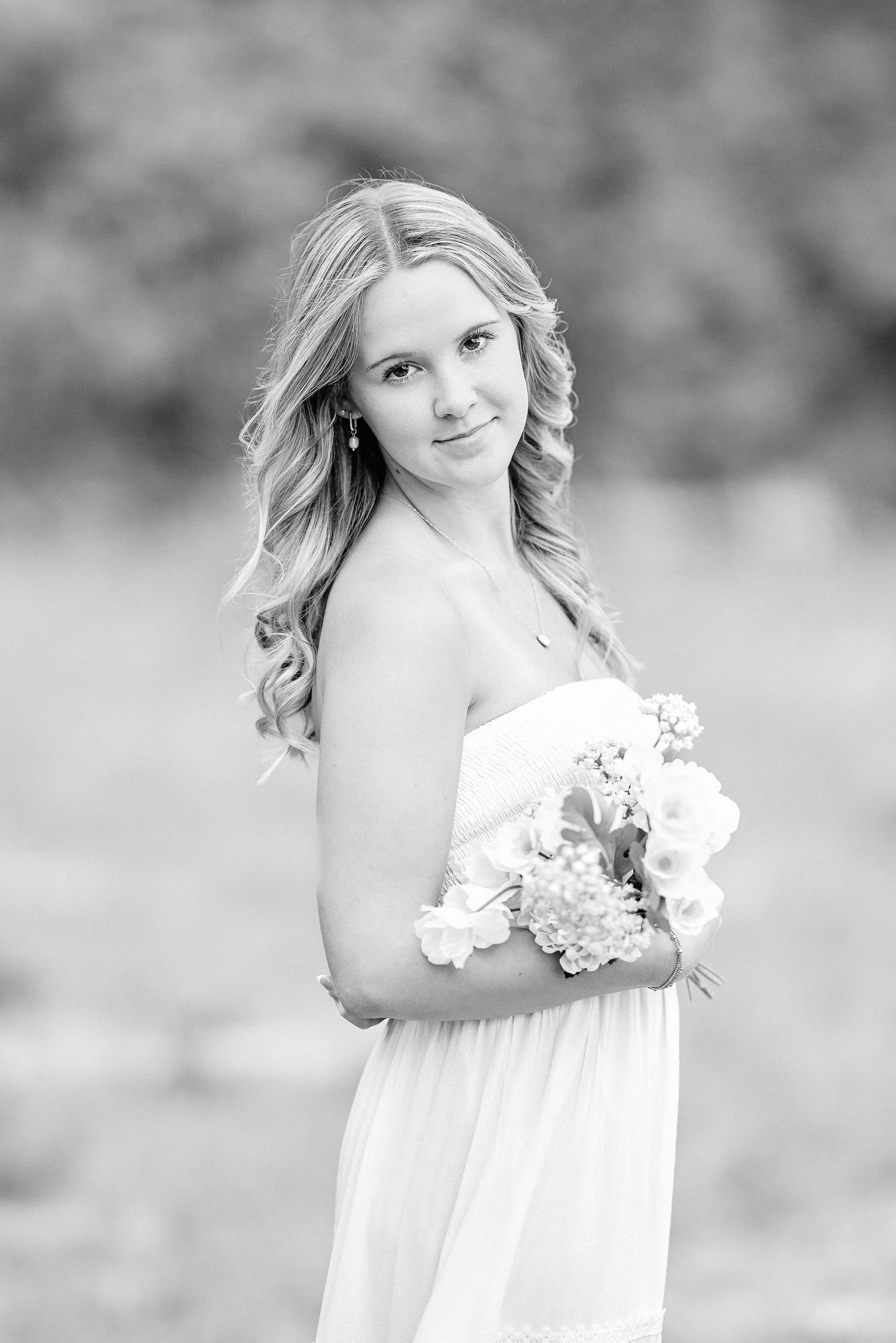 A collection of black and white portraits in an elegant outdoor setting featuring romantic soft focus effects.