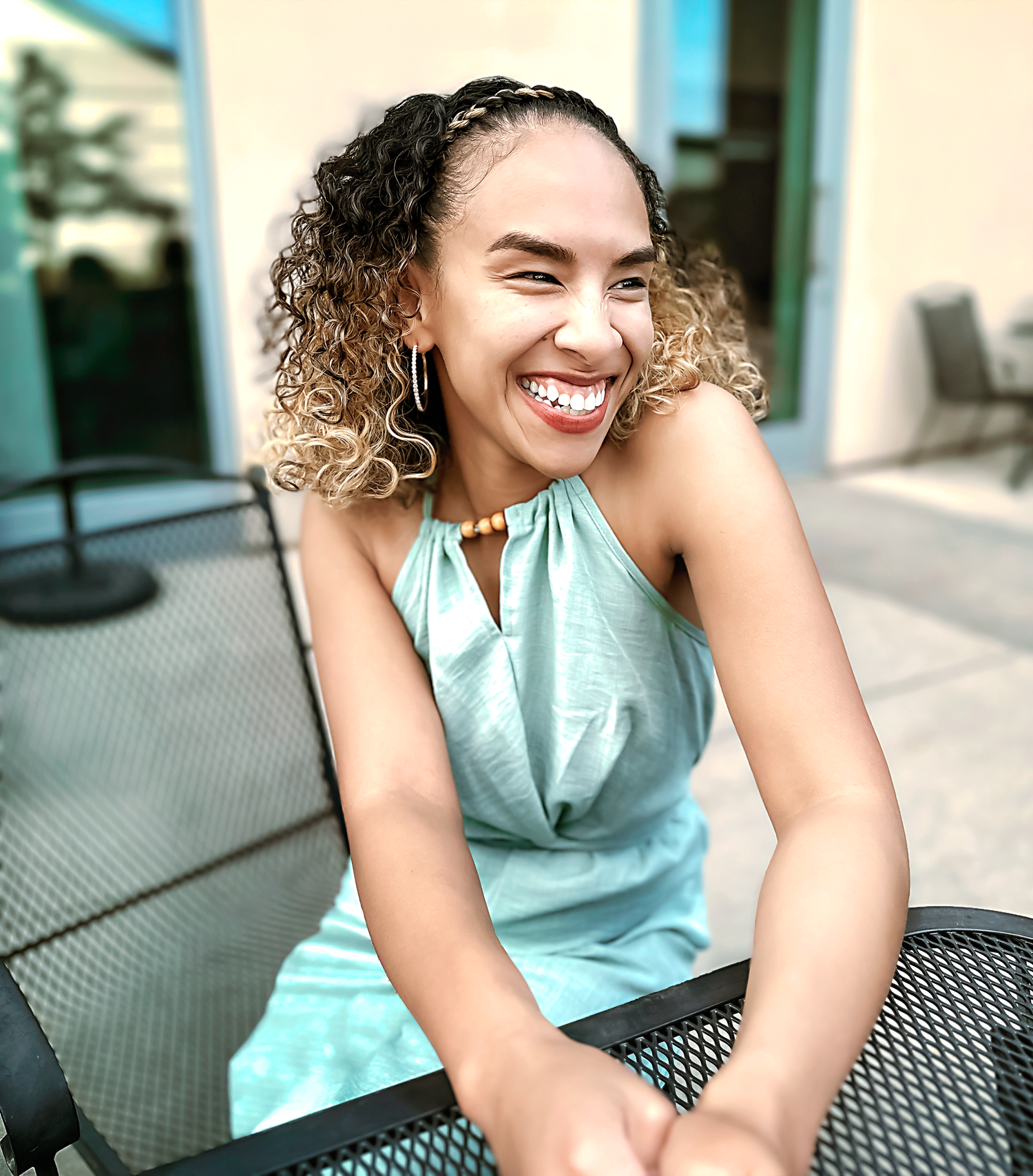 Lifestyle portraits showing joyful expressions while wearing a seafoam green sleeveless top.