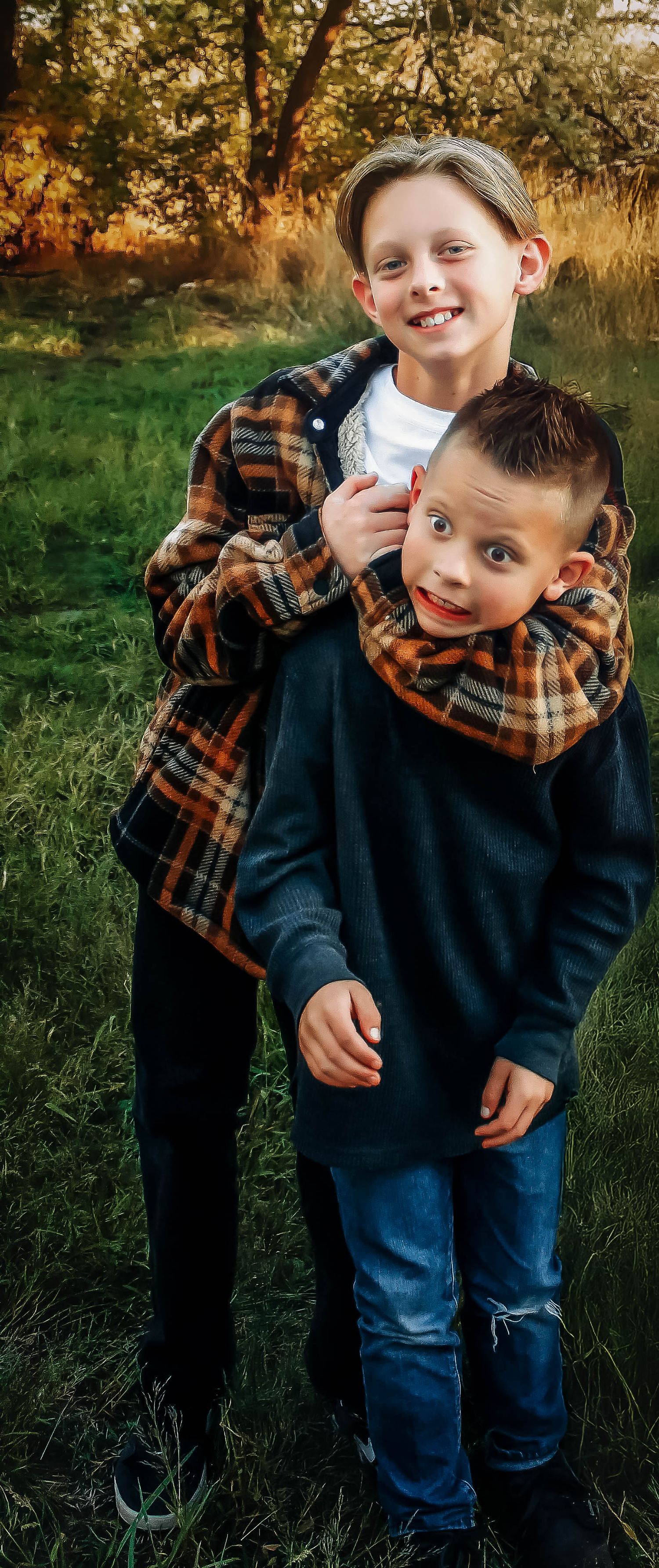 Candid playful moments captured in a series of outdoor photos on green grass.