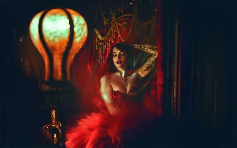 Moody cinematic scene with dramatic lighting and orange color accents.