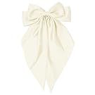 Ivory colored bows and hair accessories arranged in a decorative pattern.