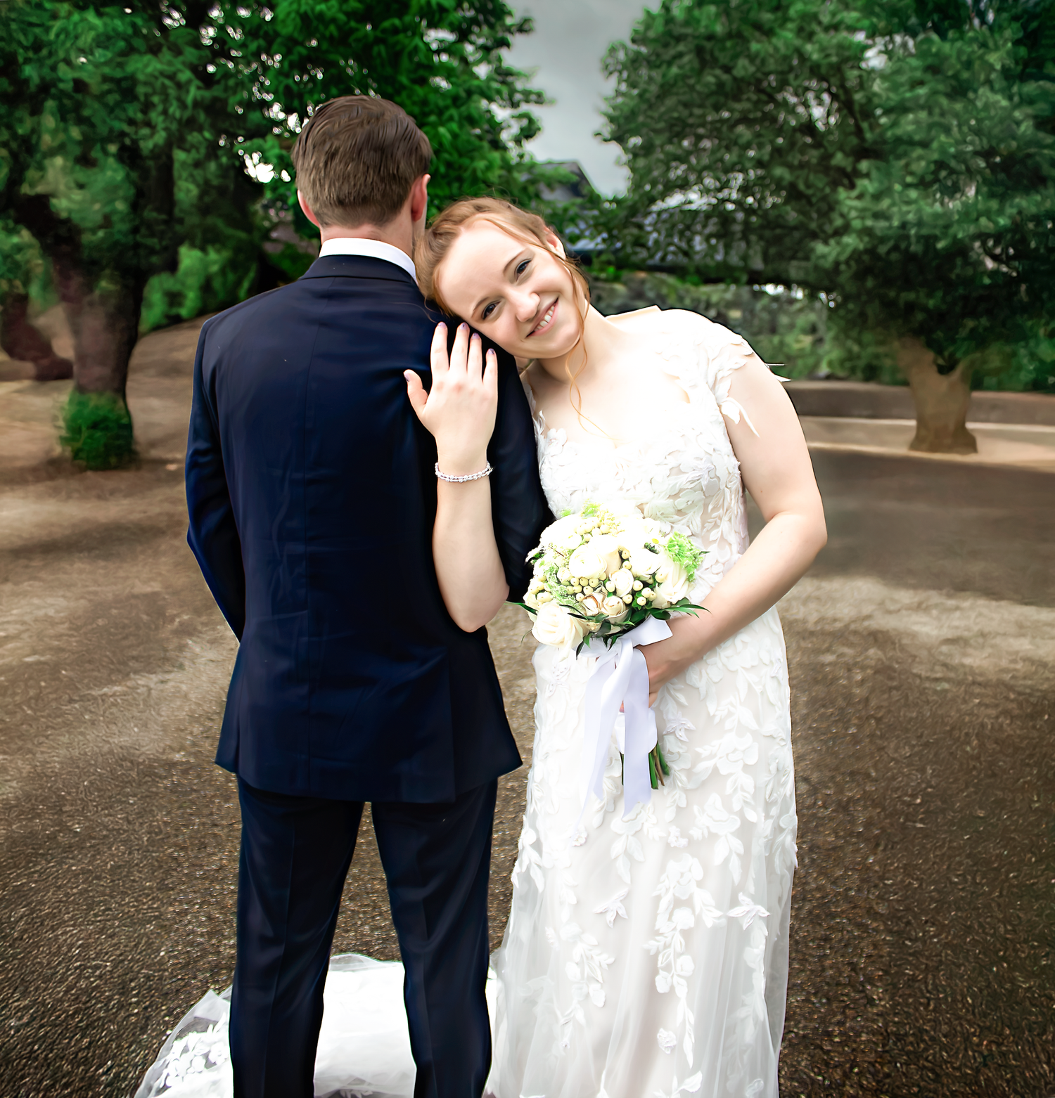 Newlyweds share intimate moments in a garden setting wearing formal wedding attire.
