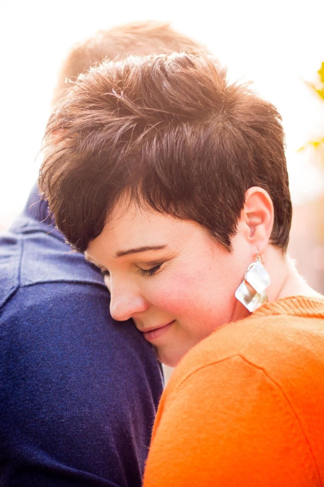 Close-up sequence showing intimate embrace with orange and navy color contrast.
