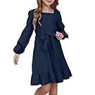Navy blue long sleeve swing dress with ruffle hem shown on model.