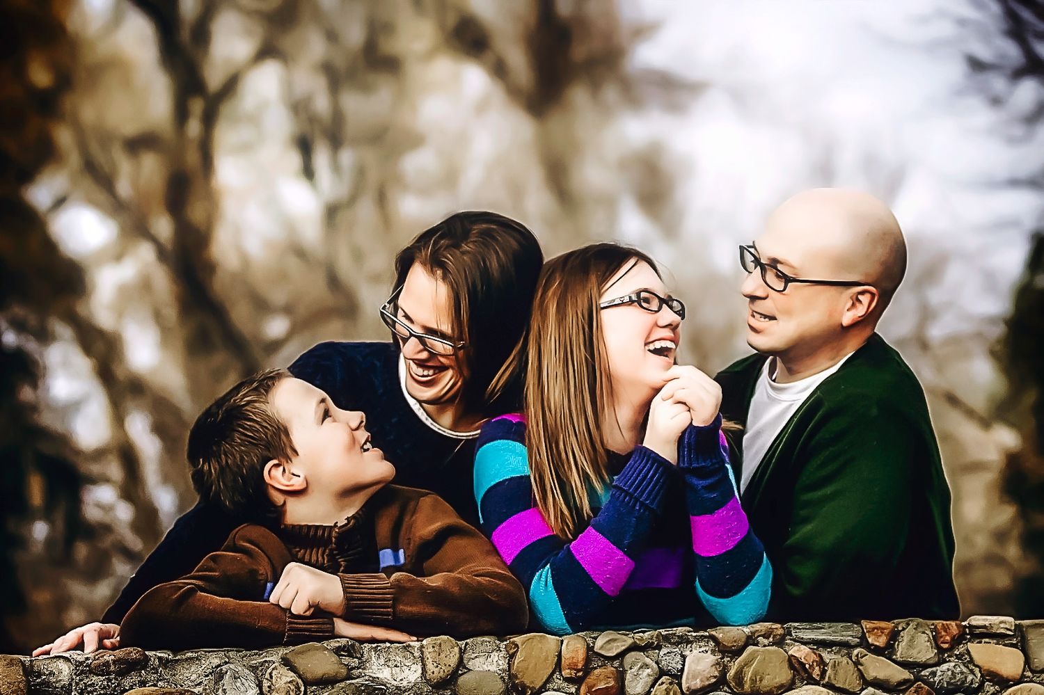 Group of friends laughing and having fun during an outdoor photo session.