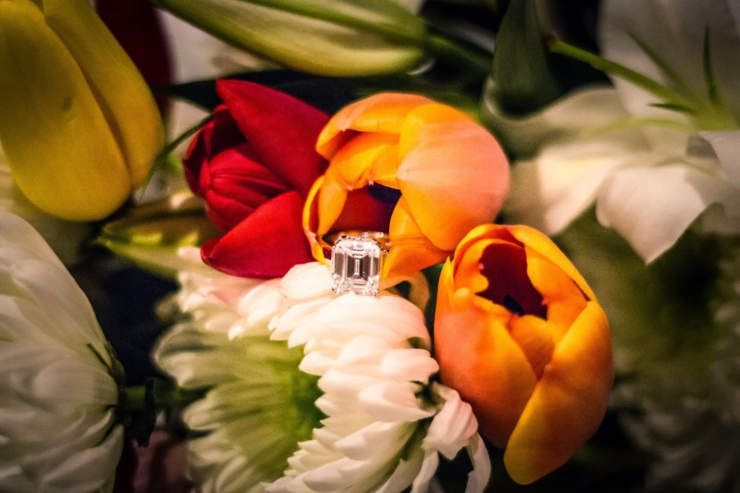 A symbol of forever and eternity nestled in the middle of a beautiful bouquet of flowers.