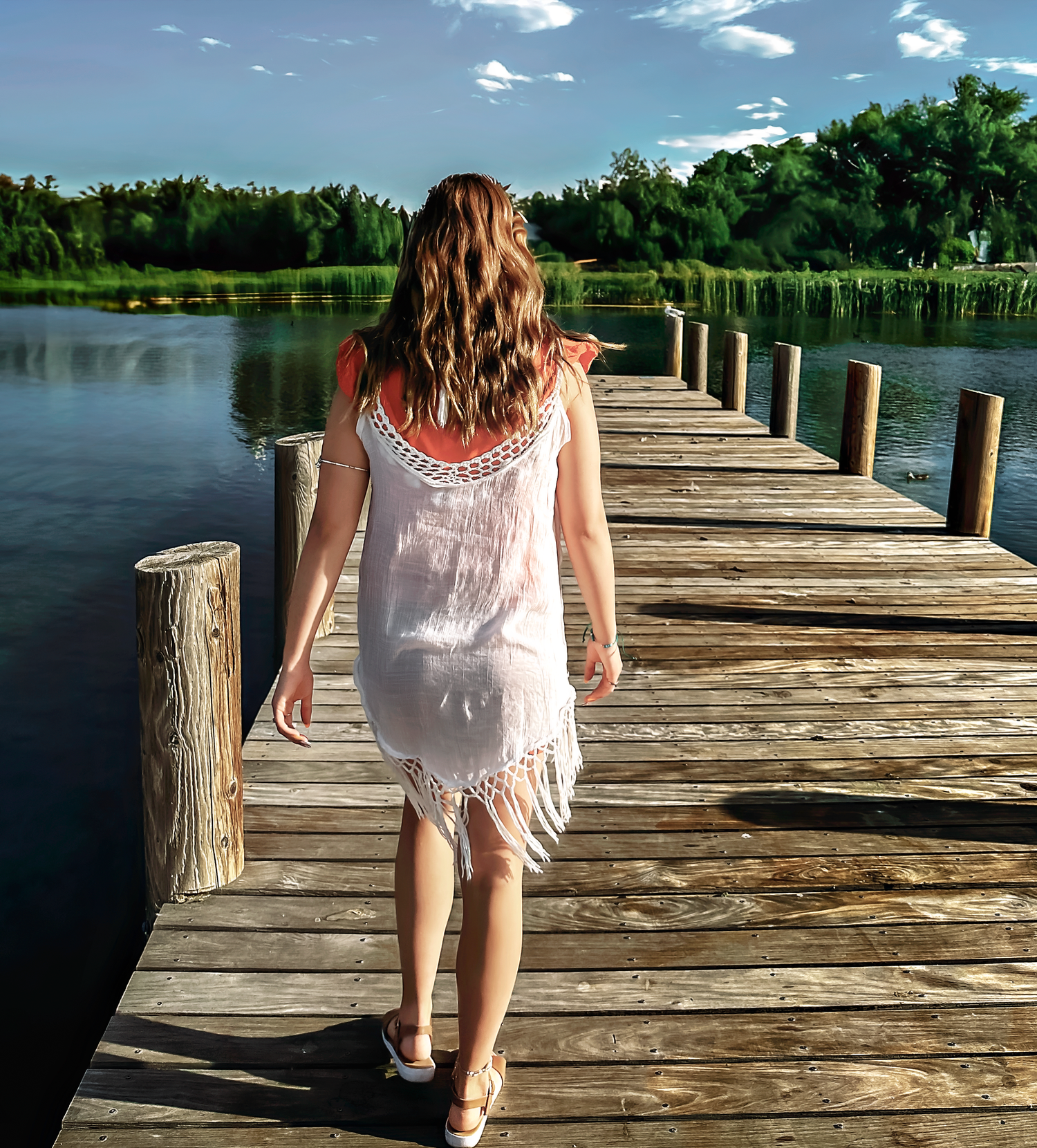 A series of photos showing someone walking along a wooden dock by a lake on a sunny day.