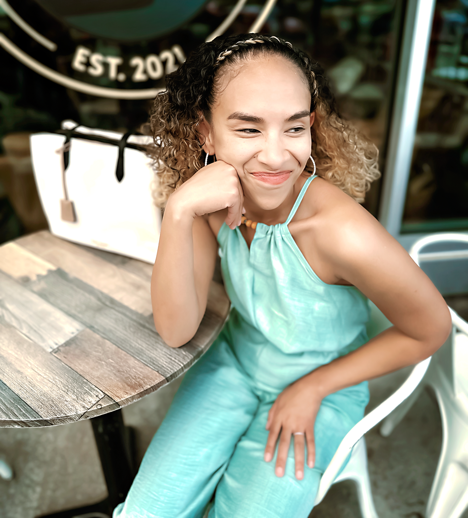 Candid lifestyle photos captured at an outdoor cafe with wooden tables.