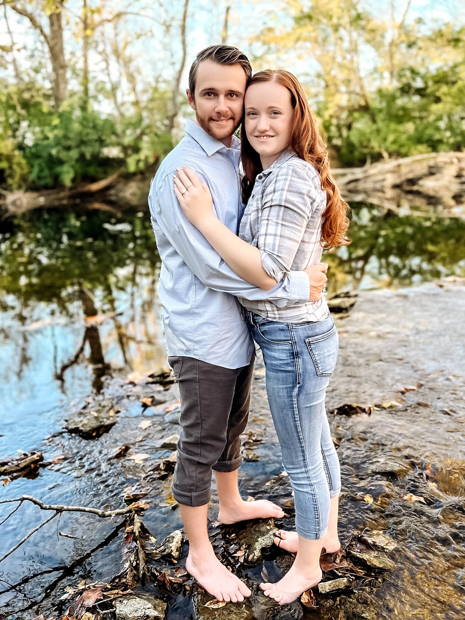 A series of intimate portraits taken near a rocky stream with autumn lighting.