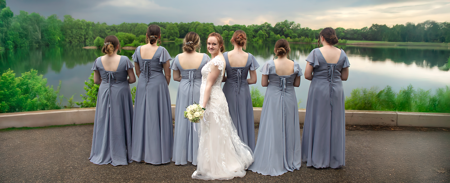 Wedding party photos featuring bridesmaids in gray dresses by lakeside setting.