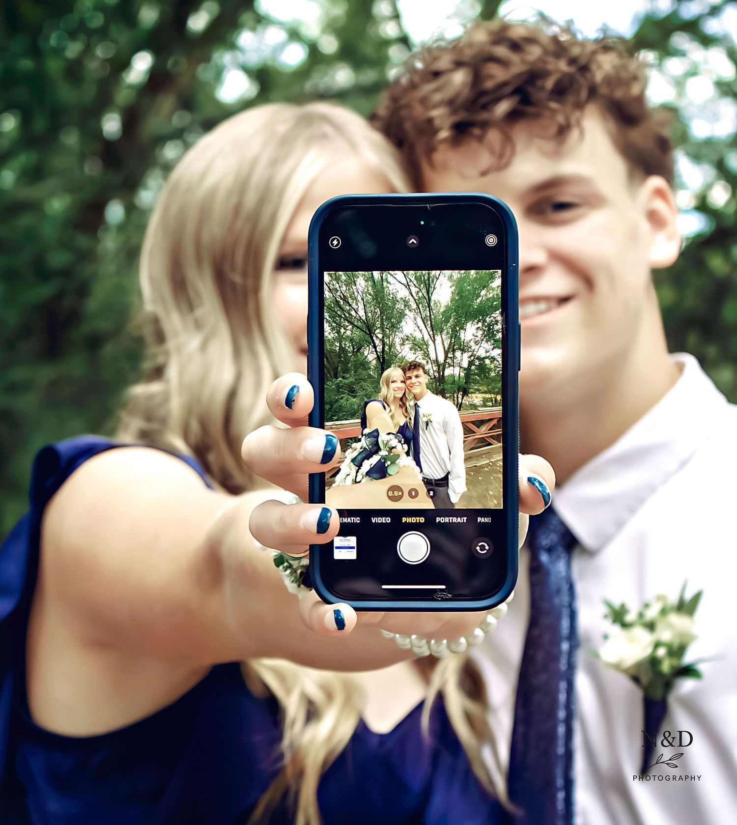Series of selfie-style photos being taken on a smartphone outdoors.