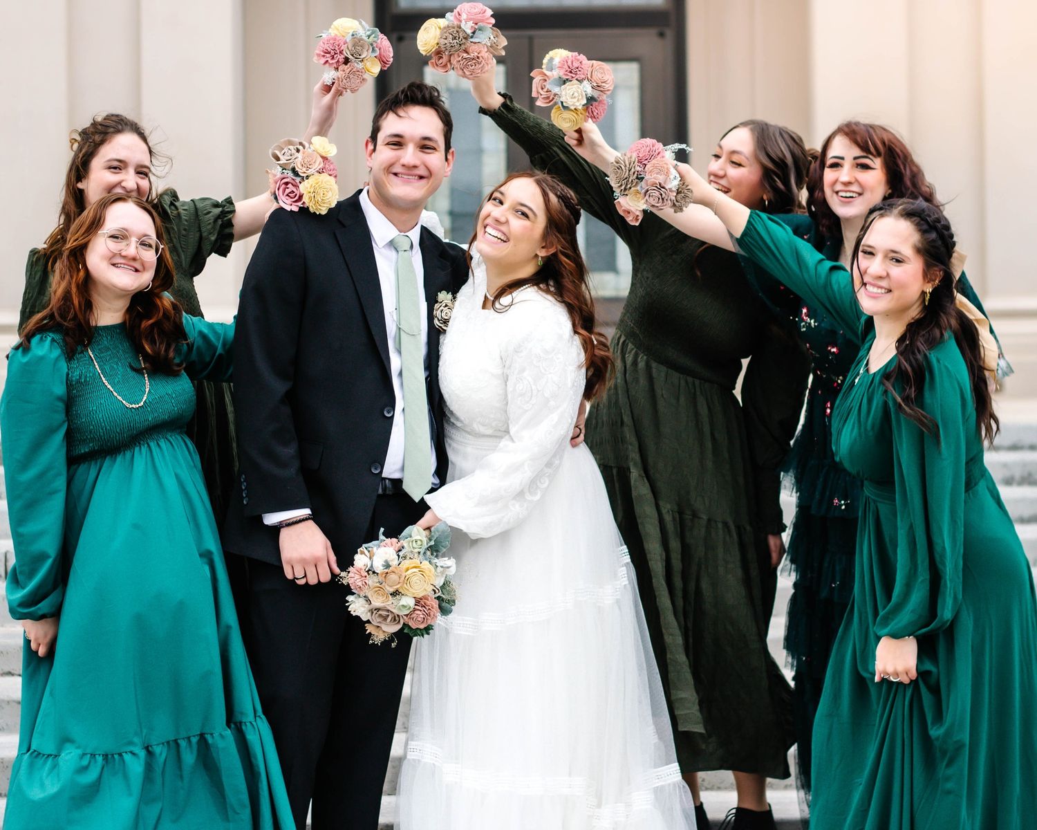 The wedding party sharing a fun filled moment together. enjoying each other's company and playful nature.