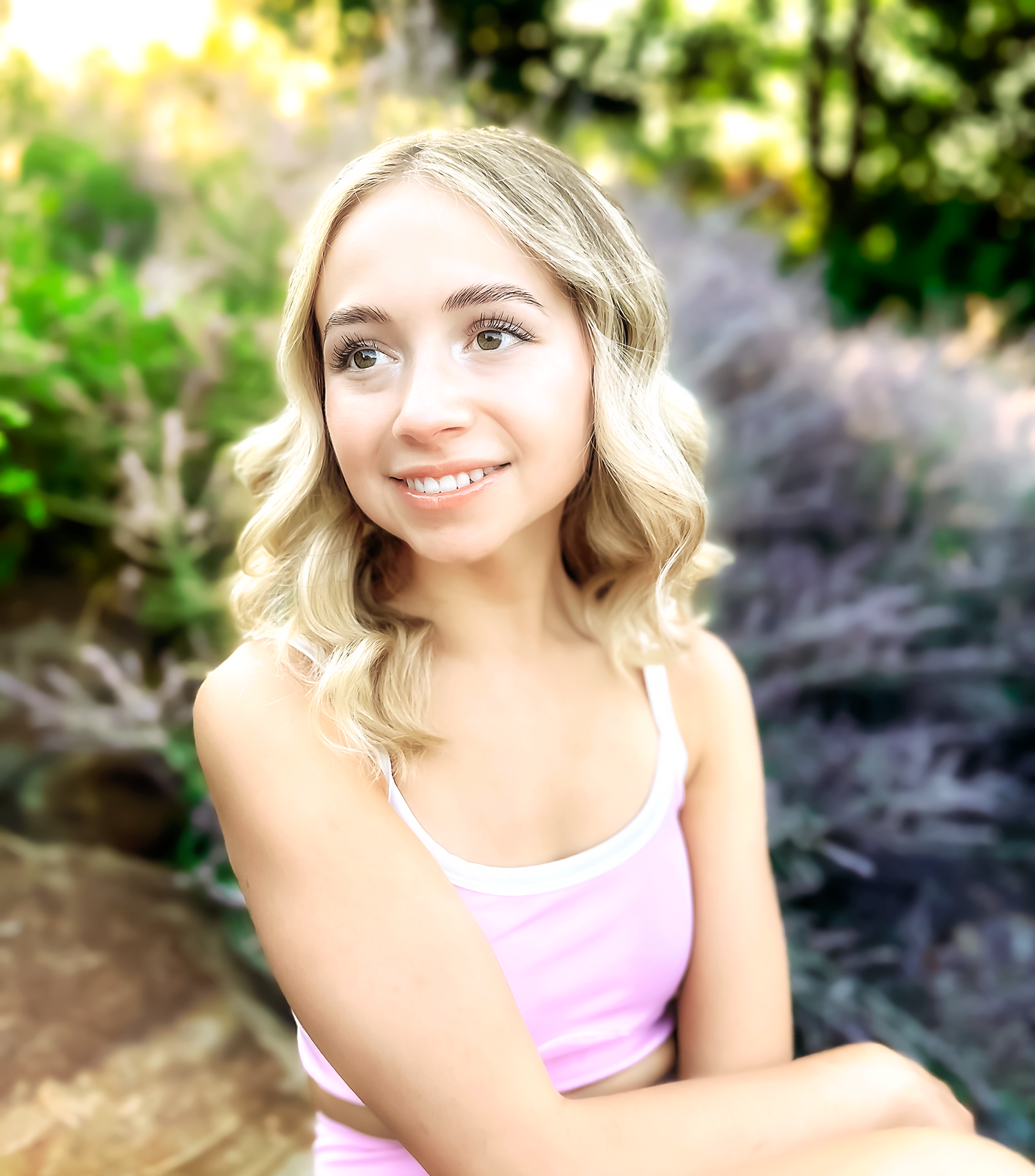 Artistic portrait series in natural lighting with soft bokeh effect and greenery in background.