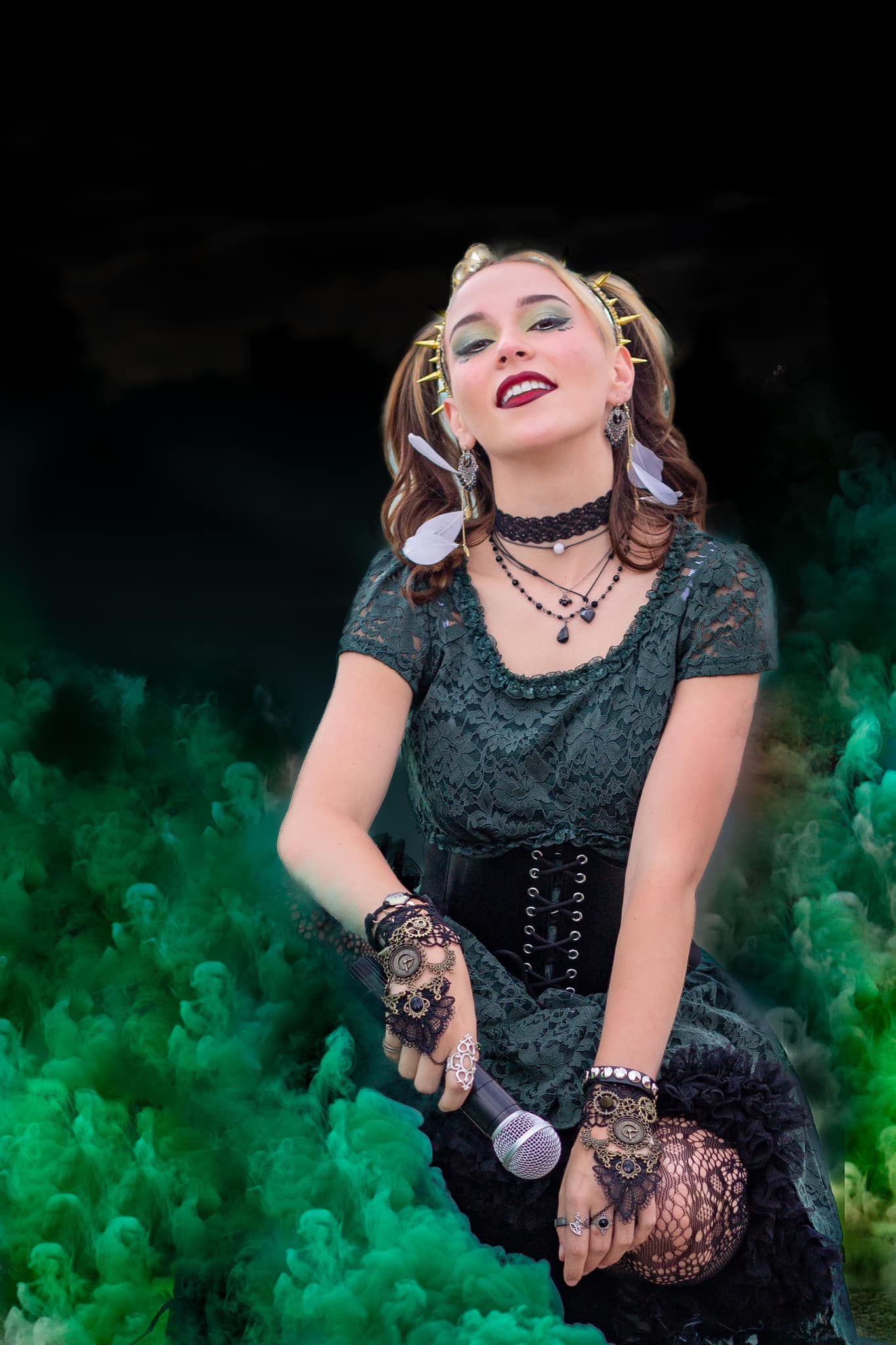 A theatrical performance with dramatic green smoke effects and gothic attire.