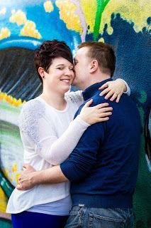 Series of affectionate moments captured against vibrant blue and yellow wall art background.