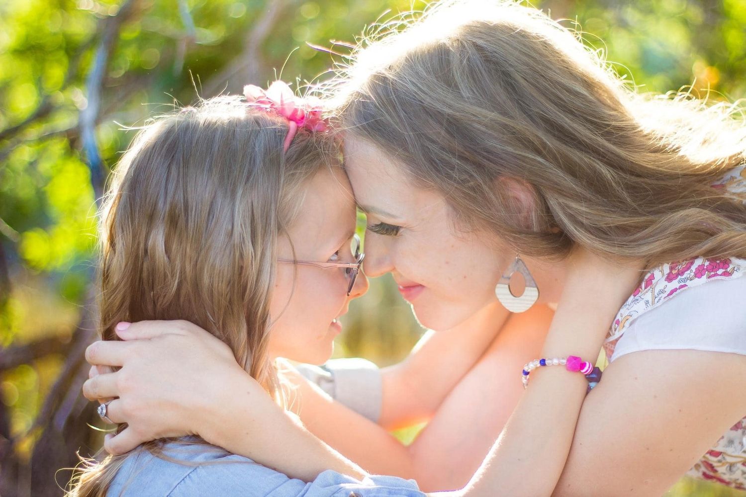 Sunlit outdoor portrait session with soft natural lighting.