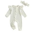 Collection of white baby onesies and rompers with delicate details arranged in a row.