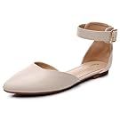 Collection of neutral colored flats and sandals arranged in a horizontal line.