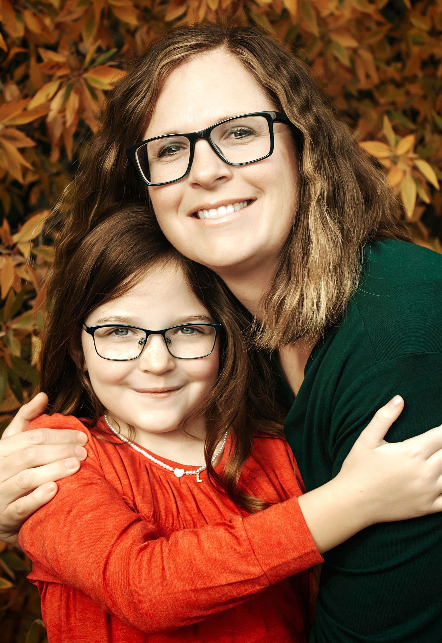 Close-up portrait against a background of golden autumn leaves.