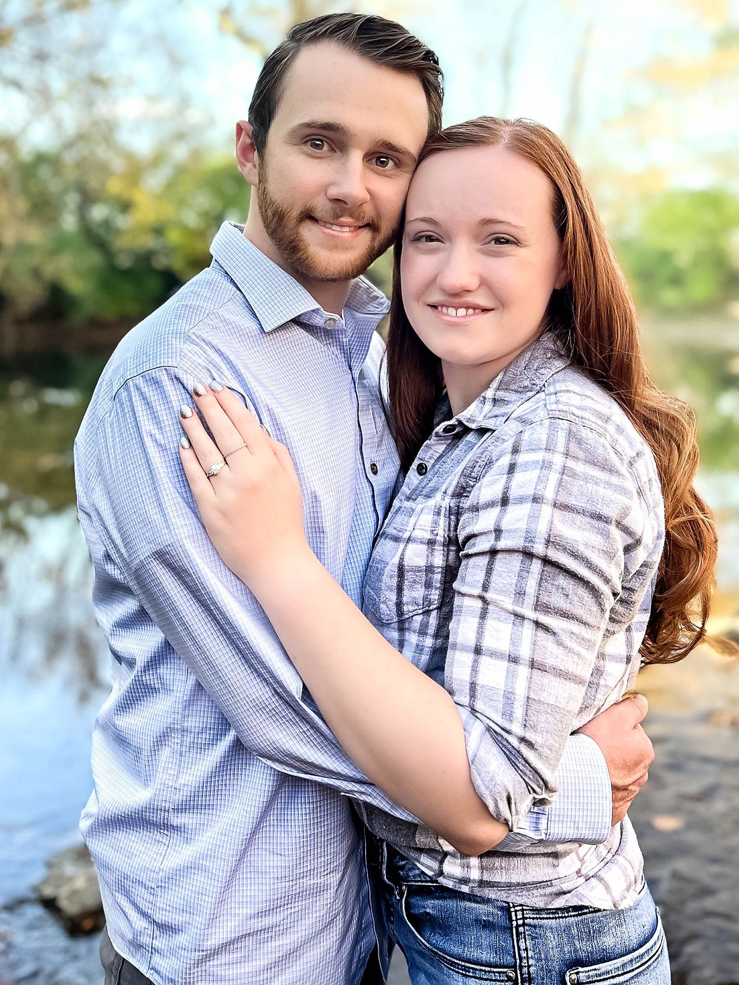 Romantic couple photos showing affectionate poses by a waterfront setting.