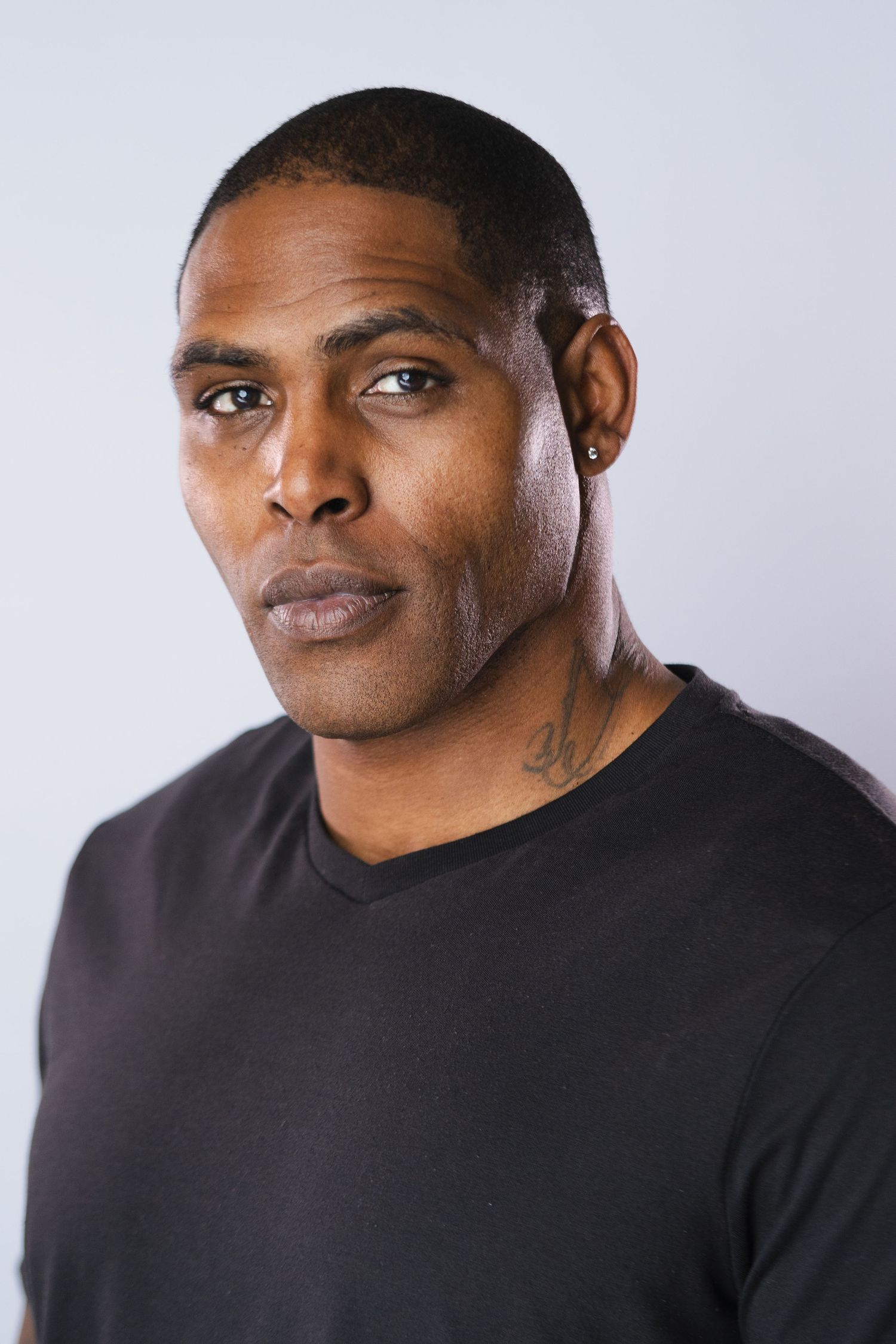 Close-up portrait series in black shirt showing expressive facial features against light background.
