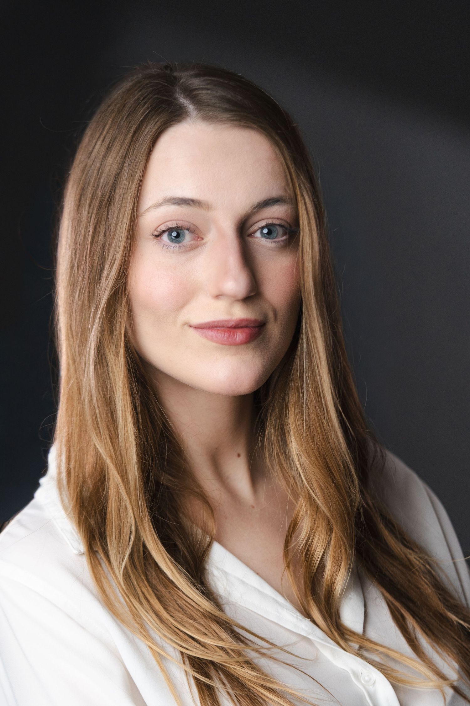 Professional headshots against dark background showing various angles in white clothing.