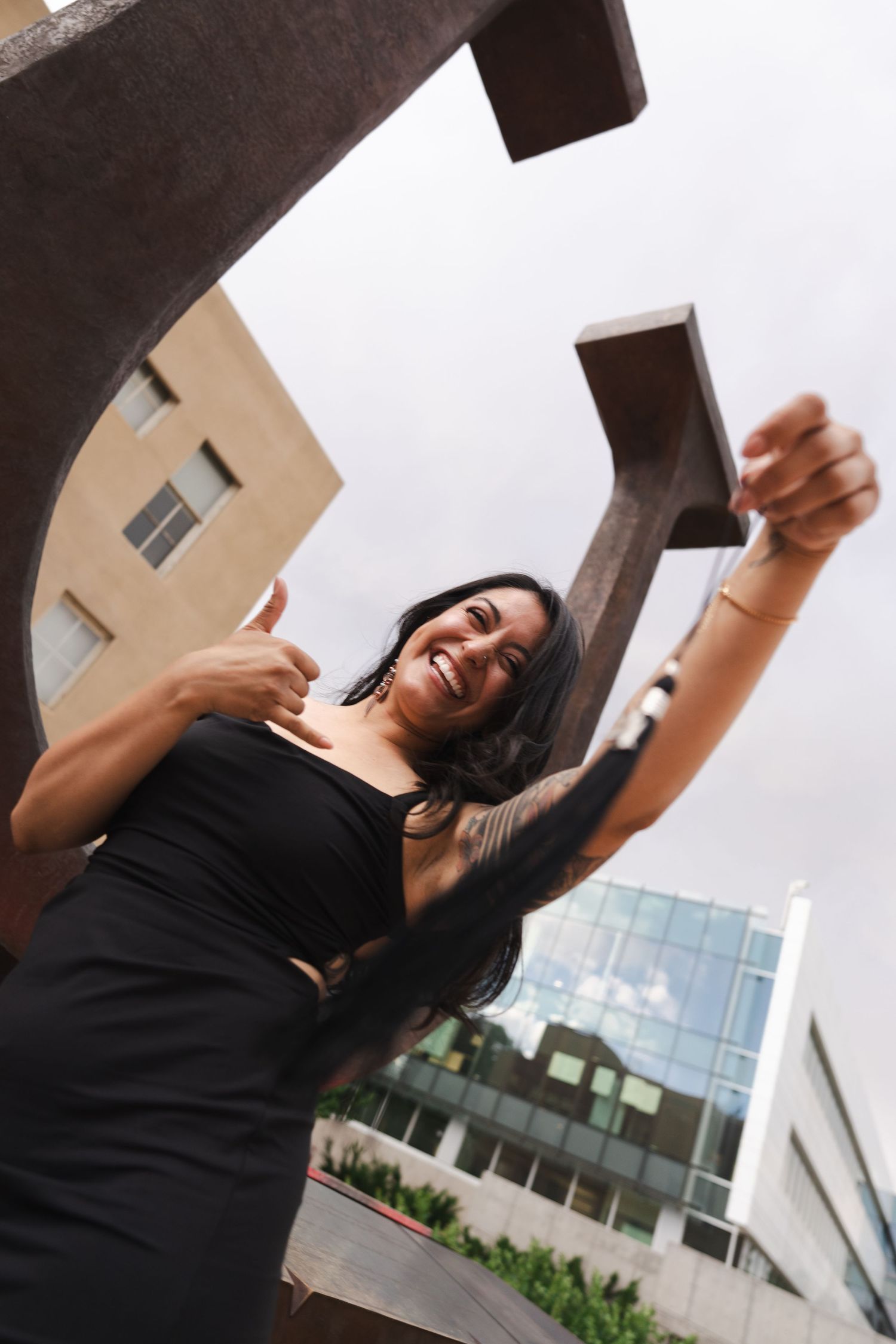 Dynamic low-angle architectural photoshoot with modern building backdrop.