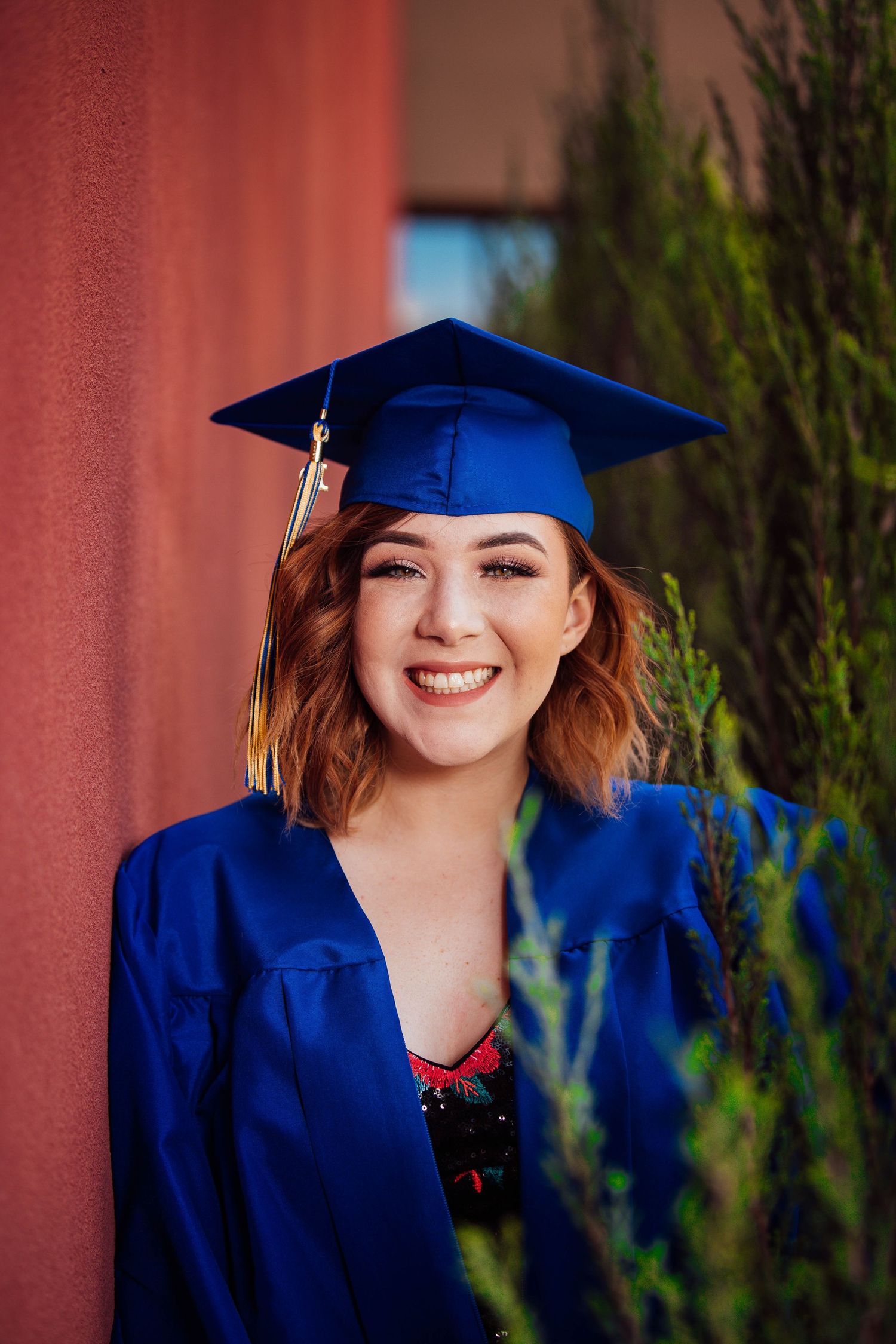 New Mexico Photographer - Graduation A graduation portrait series showing a person in royal blue cap and gown.