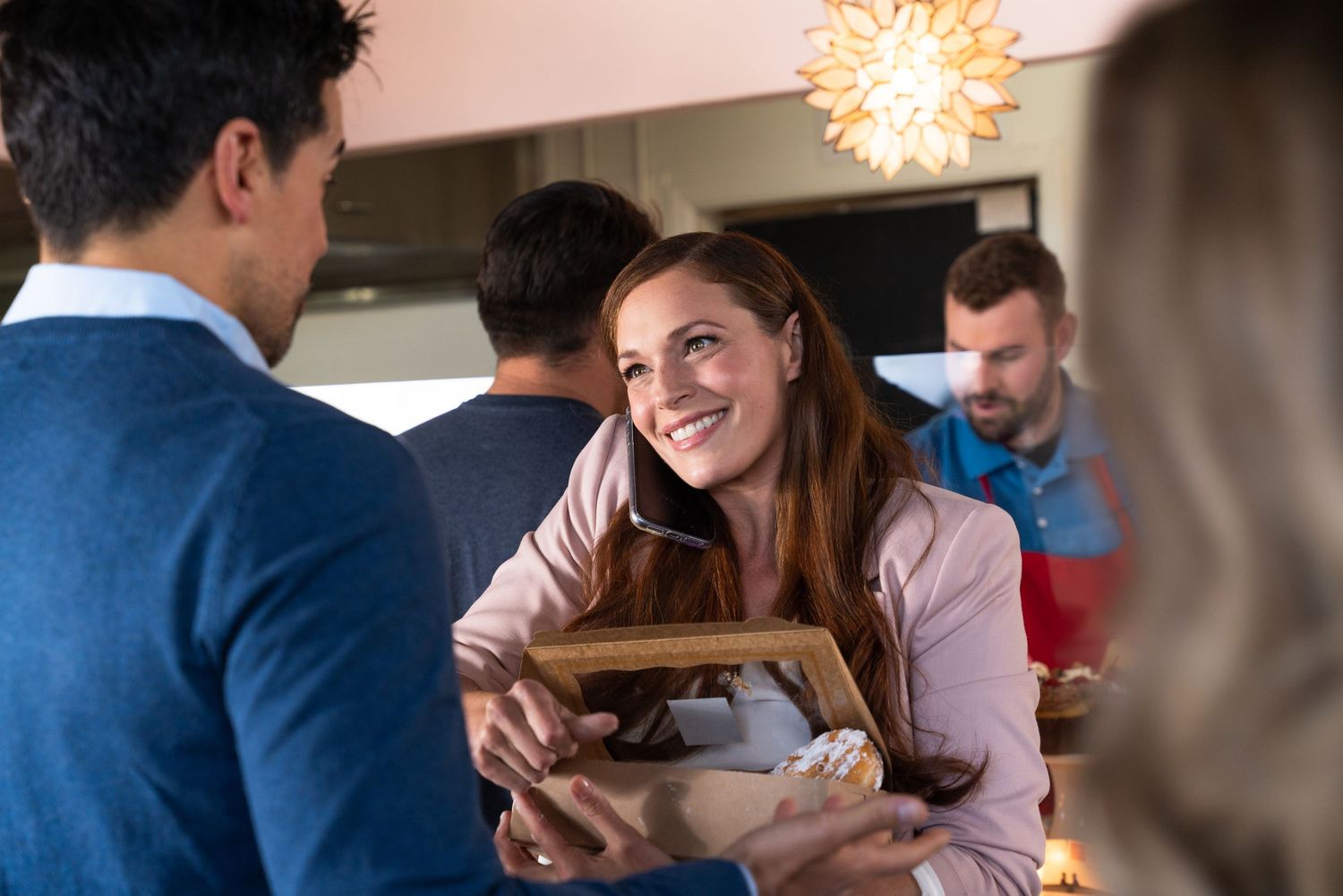 People gathered in bright indoor setting during casual social event.