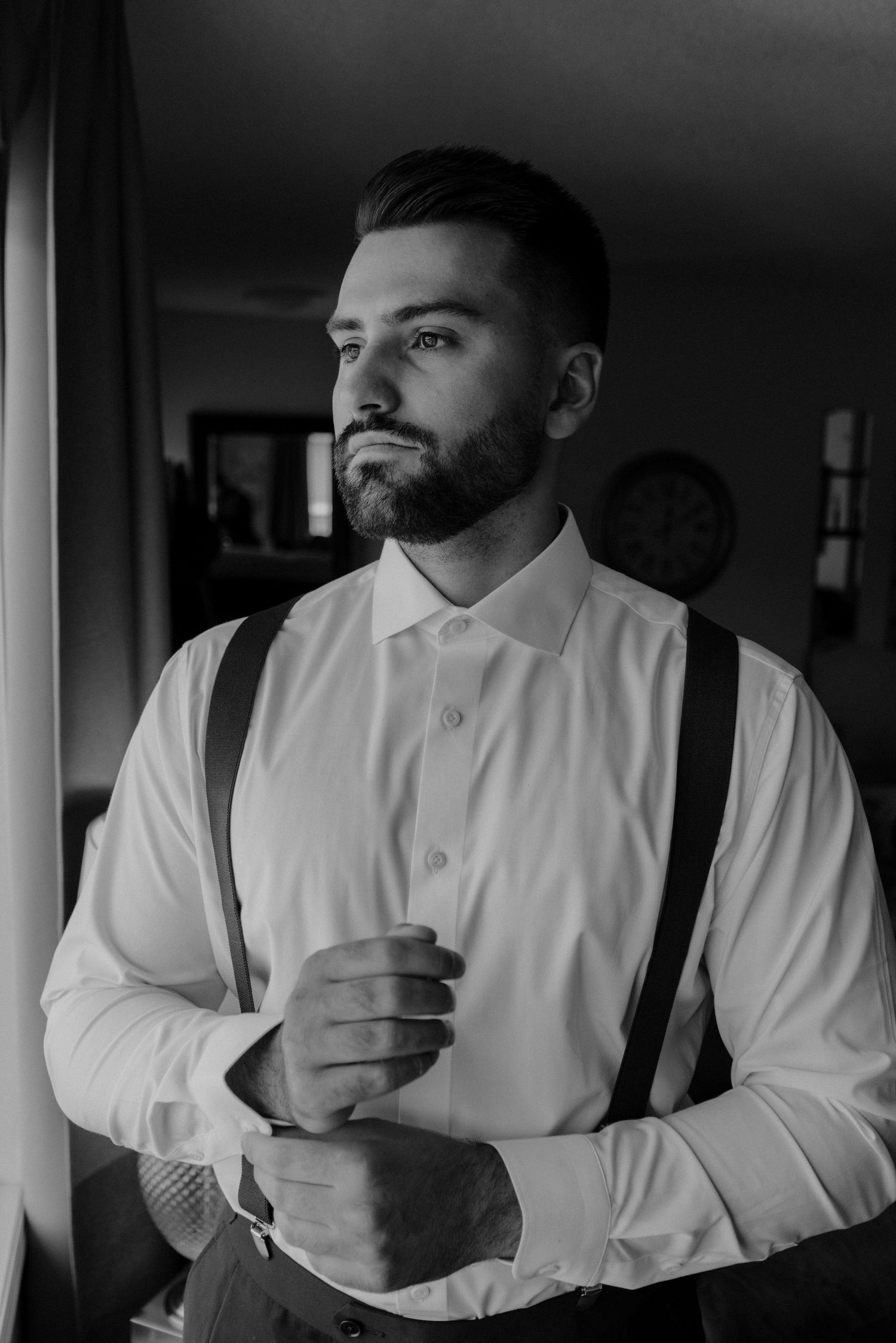 Black and white portrait series showing a bearded man in white shirt looking thoughtful against dark background.
