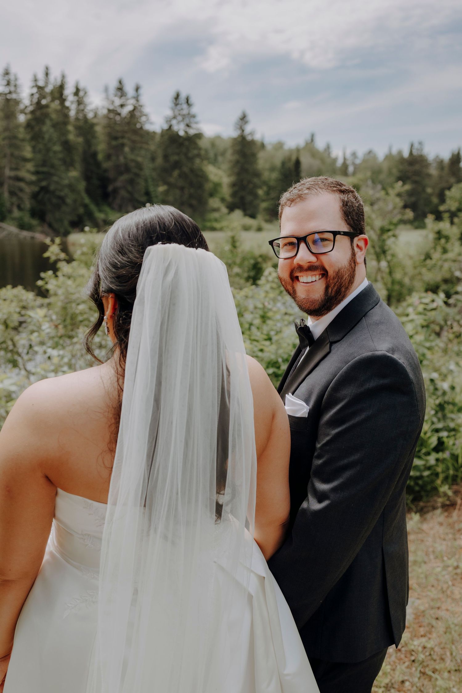 A sequence of wedding photos showing a couple in formal attire outdoors with evergreen trees in the background.