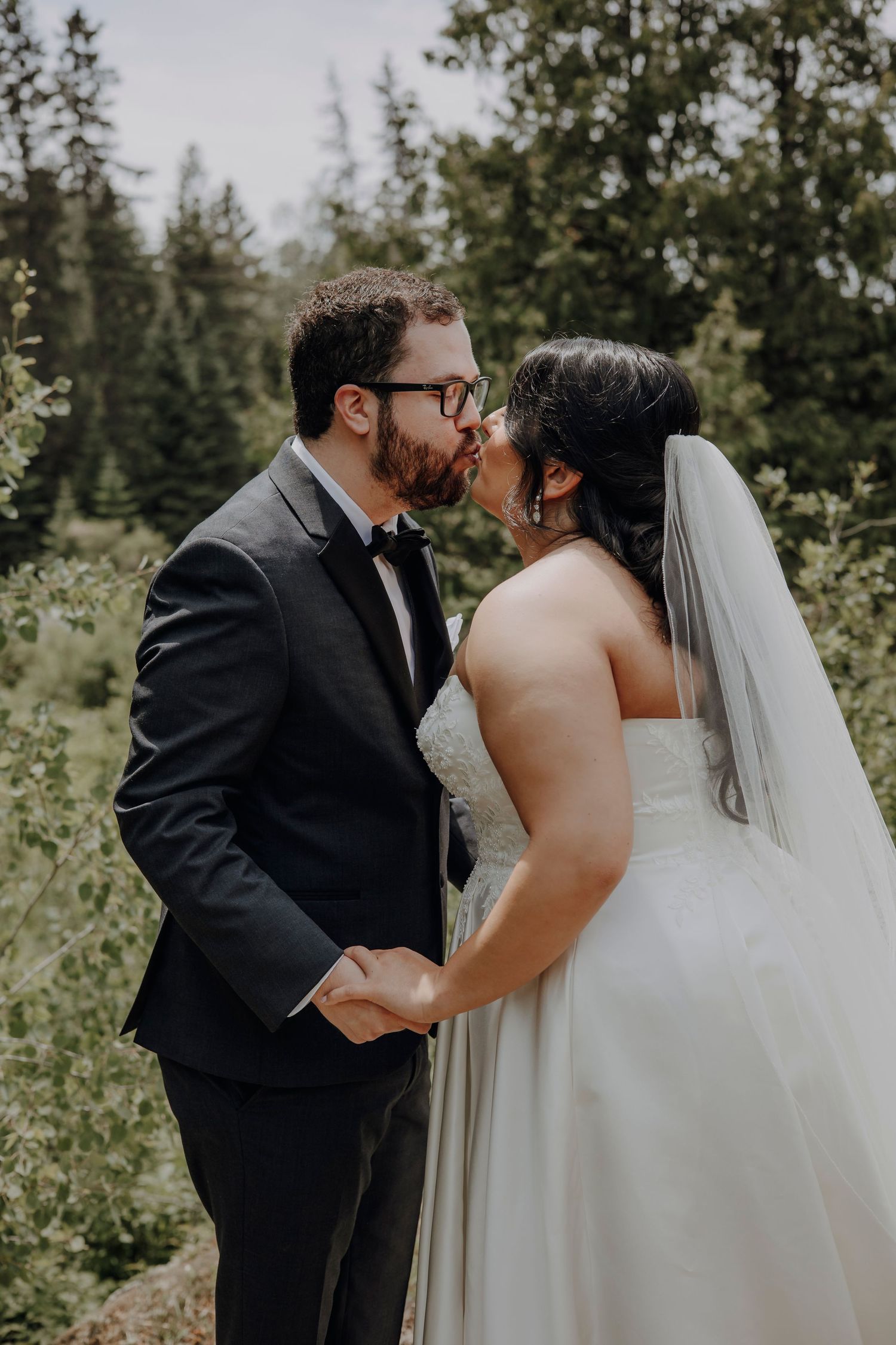 A series of intimate wedding photos showing tender moments between newlyweds against a natural forest backdrop.