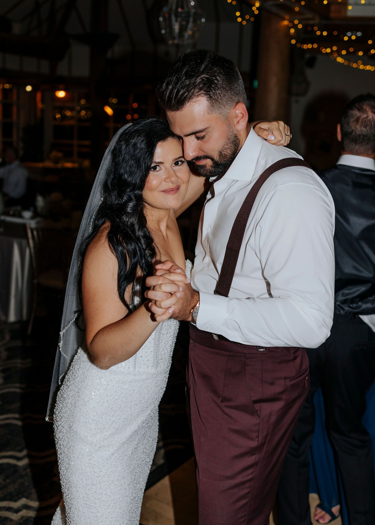 Romantic dance floor moments between newlyweds at their wedding reception.