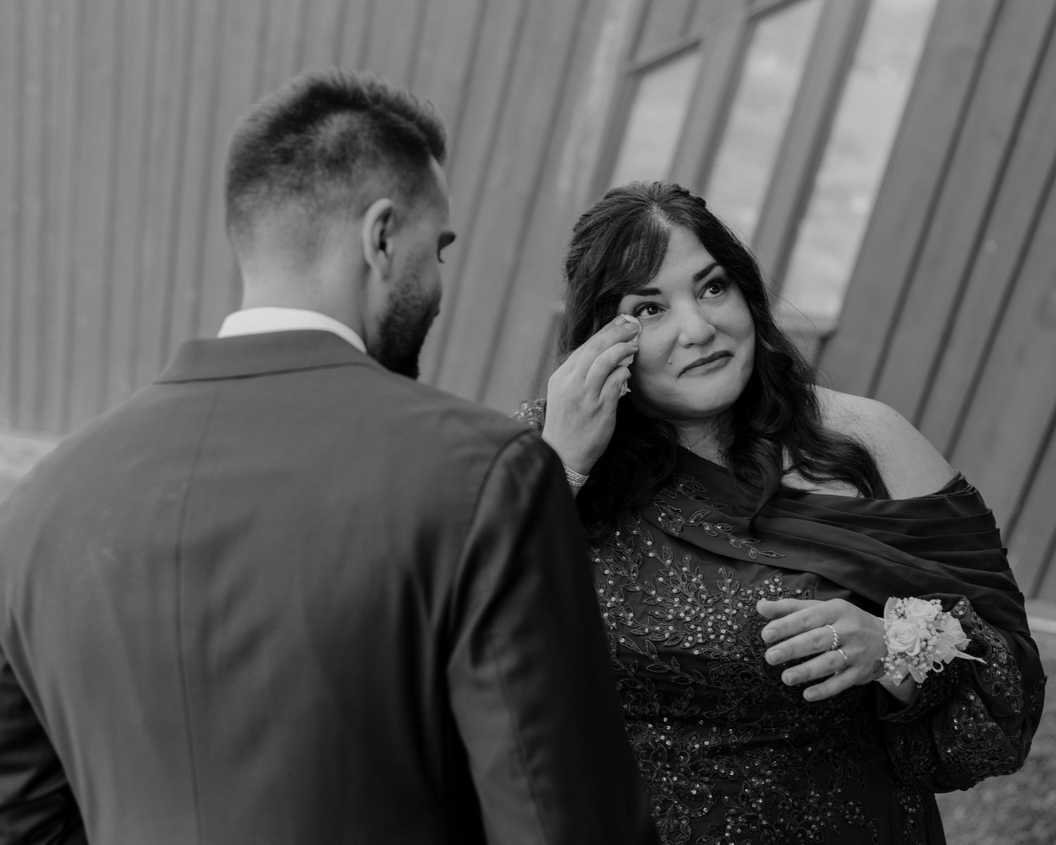 Black and white photo sequence showing emotional wedding moments.