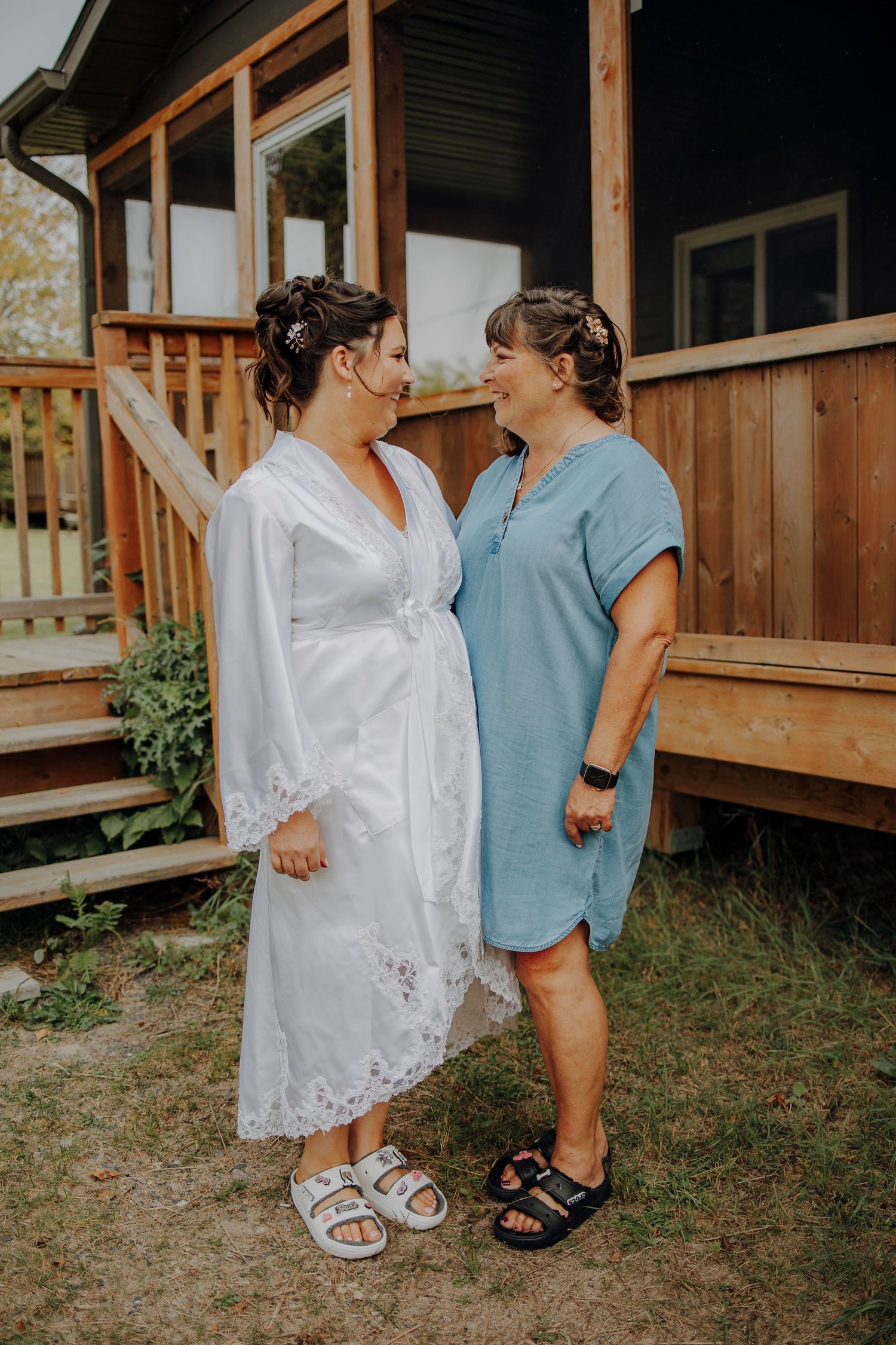 Getting ready photos showing wedding day preparations with matching robes and sandals.