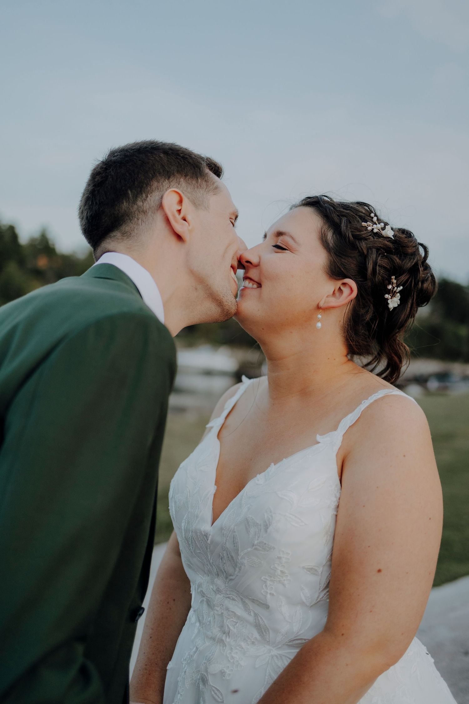 Romantic seaside wedding portraits showing tender moments between newlyweds.