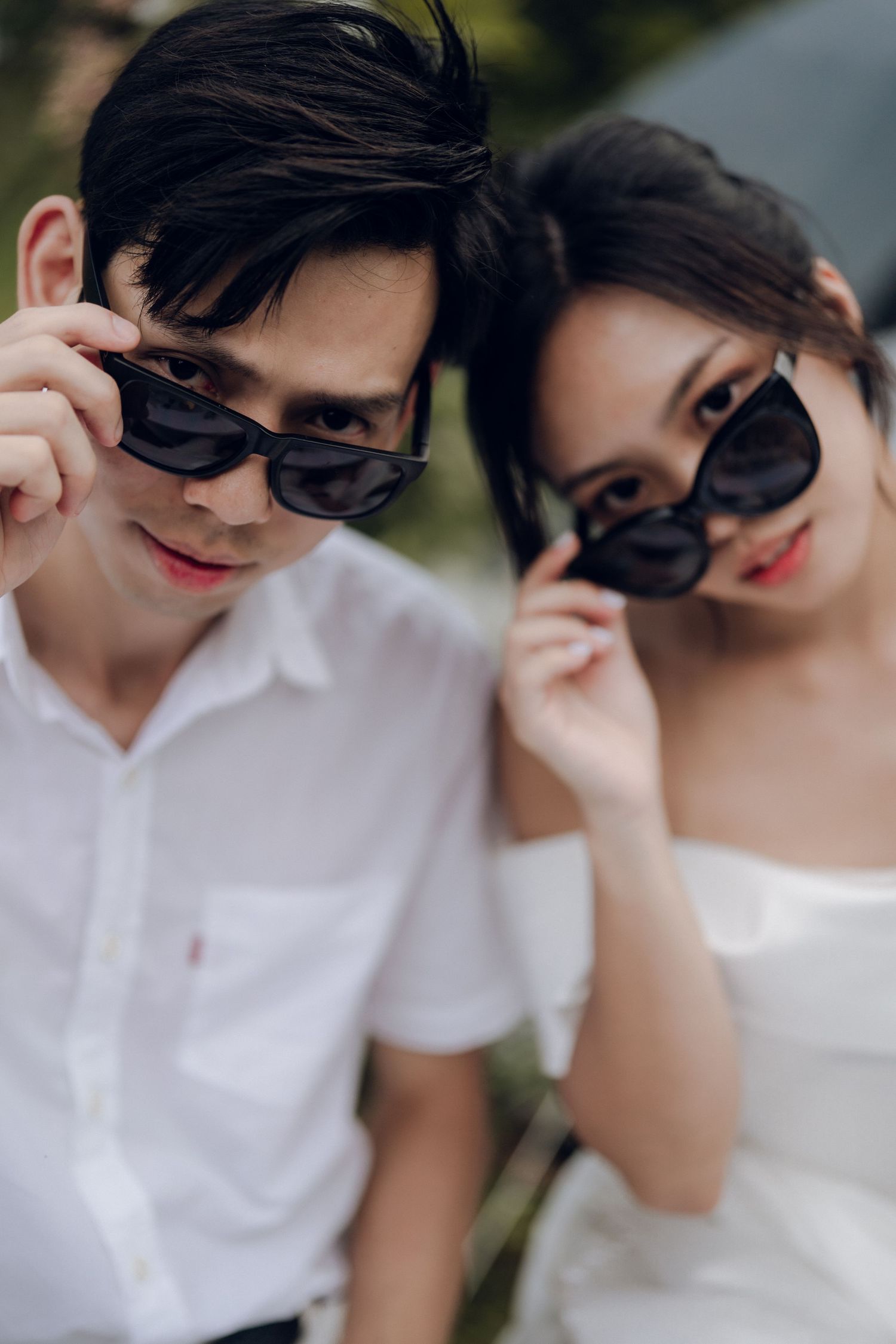 A couple in sunglasses and formal attire share intimate moments in a series of romantic close-up shots.