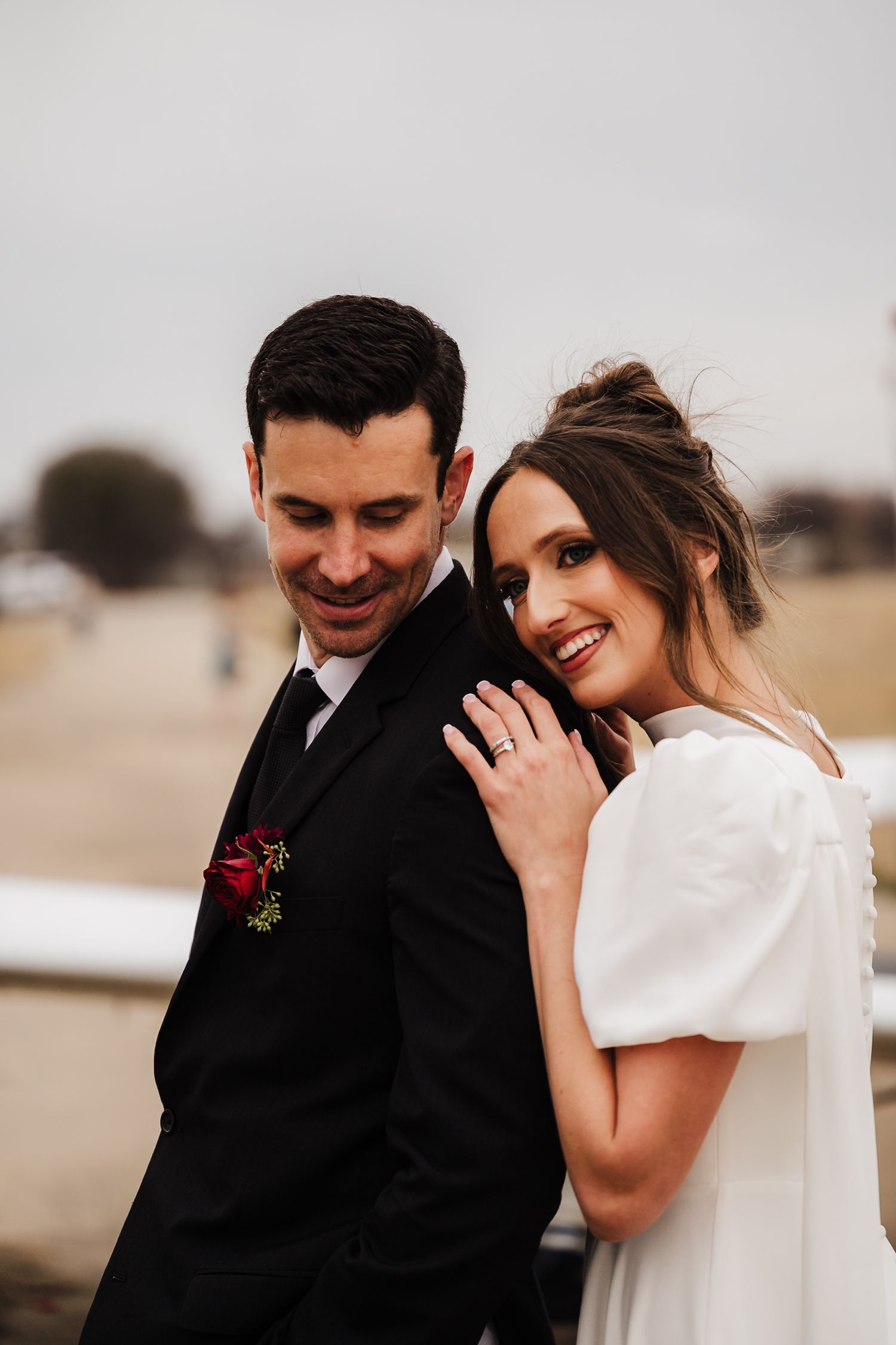 A couple laughs together in a romantic moment captured across multiple candid wedding photos in an outdoor setting.