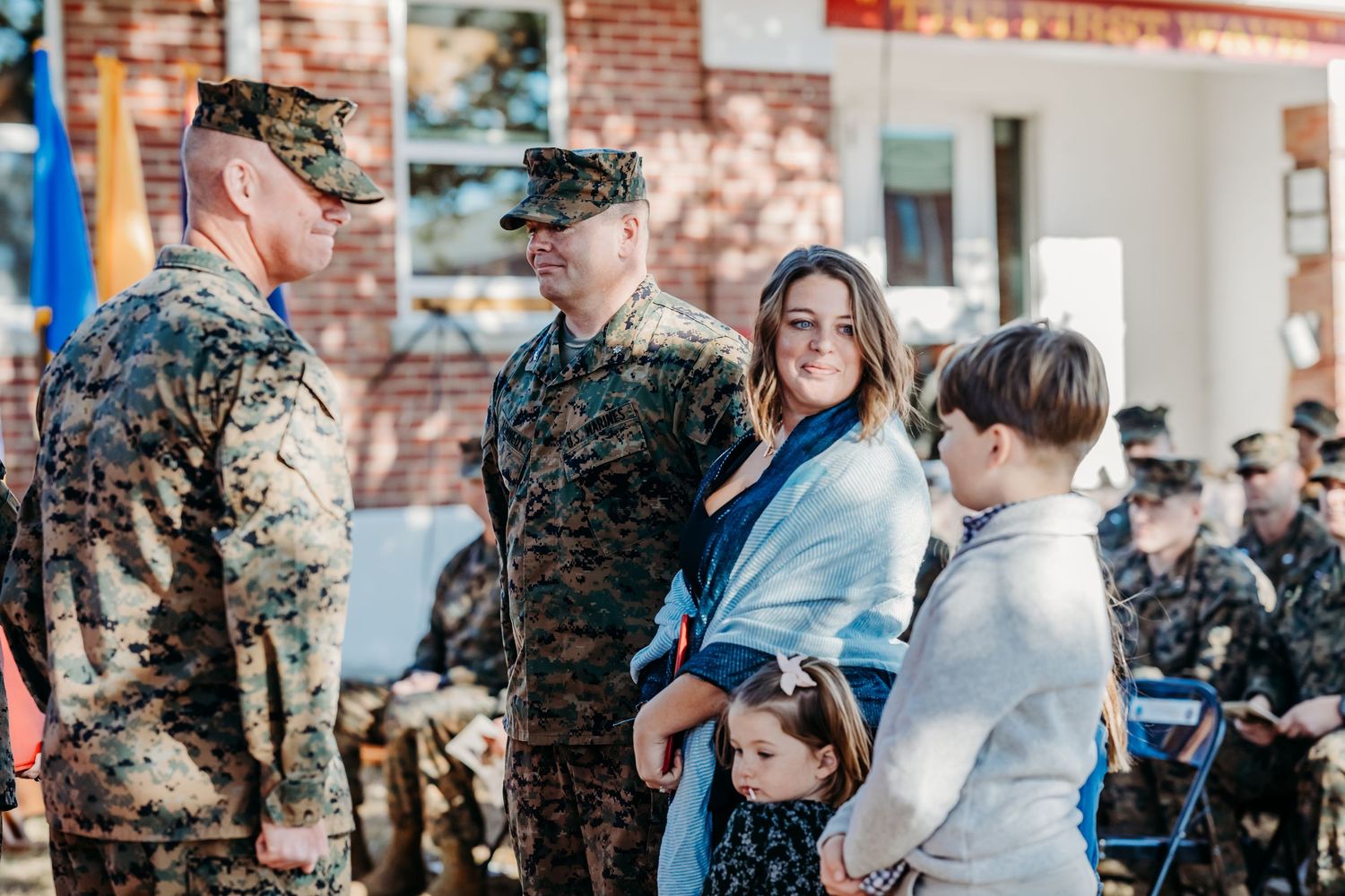 Military ceremony captured indoors with guests and service members in attendance.