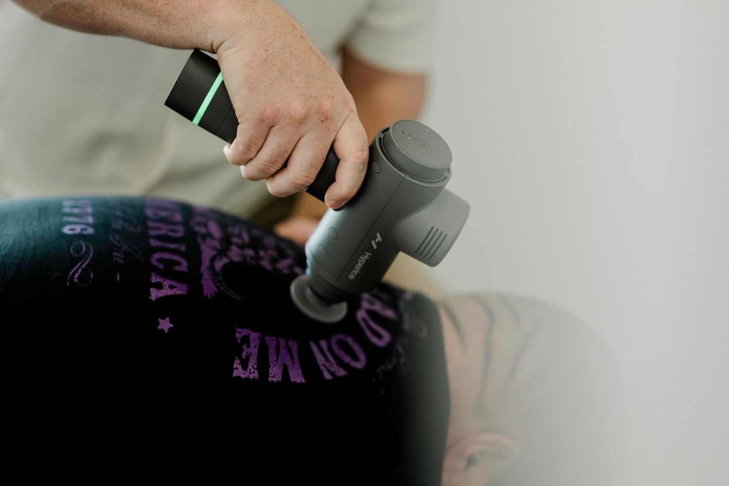 Close-up shot of hands massaging a person's neck and shoulders during a therapeutic session.