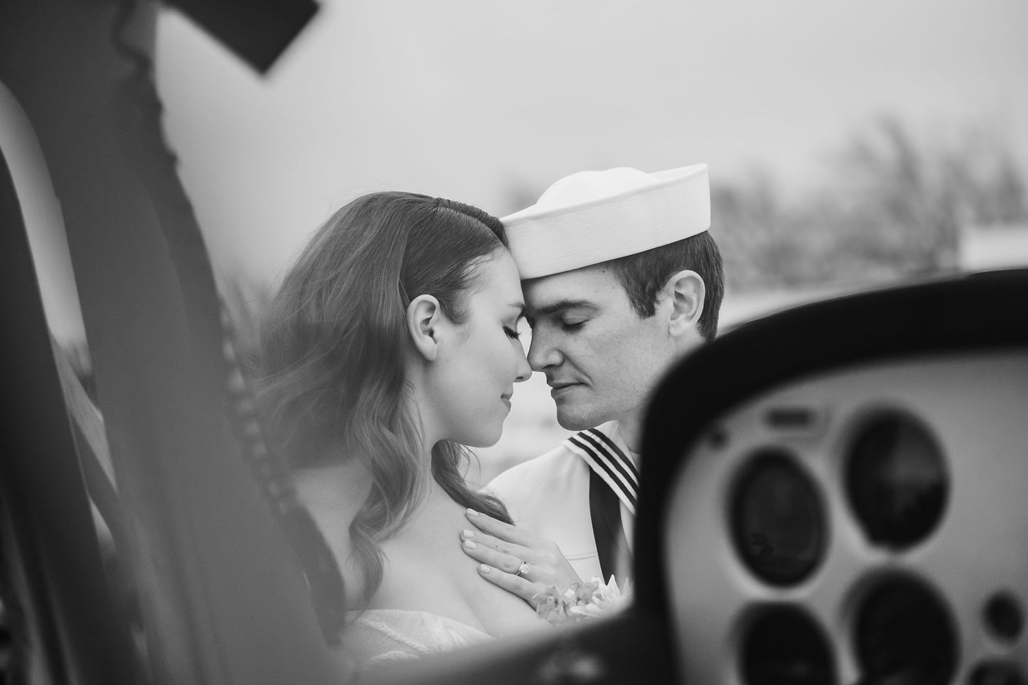 A romantic black and white photo montage shows six intimate couples kissing and embracing in various settings.