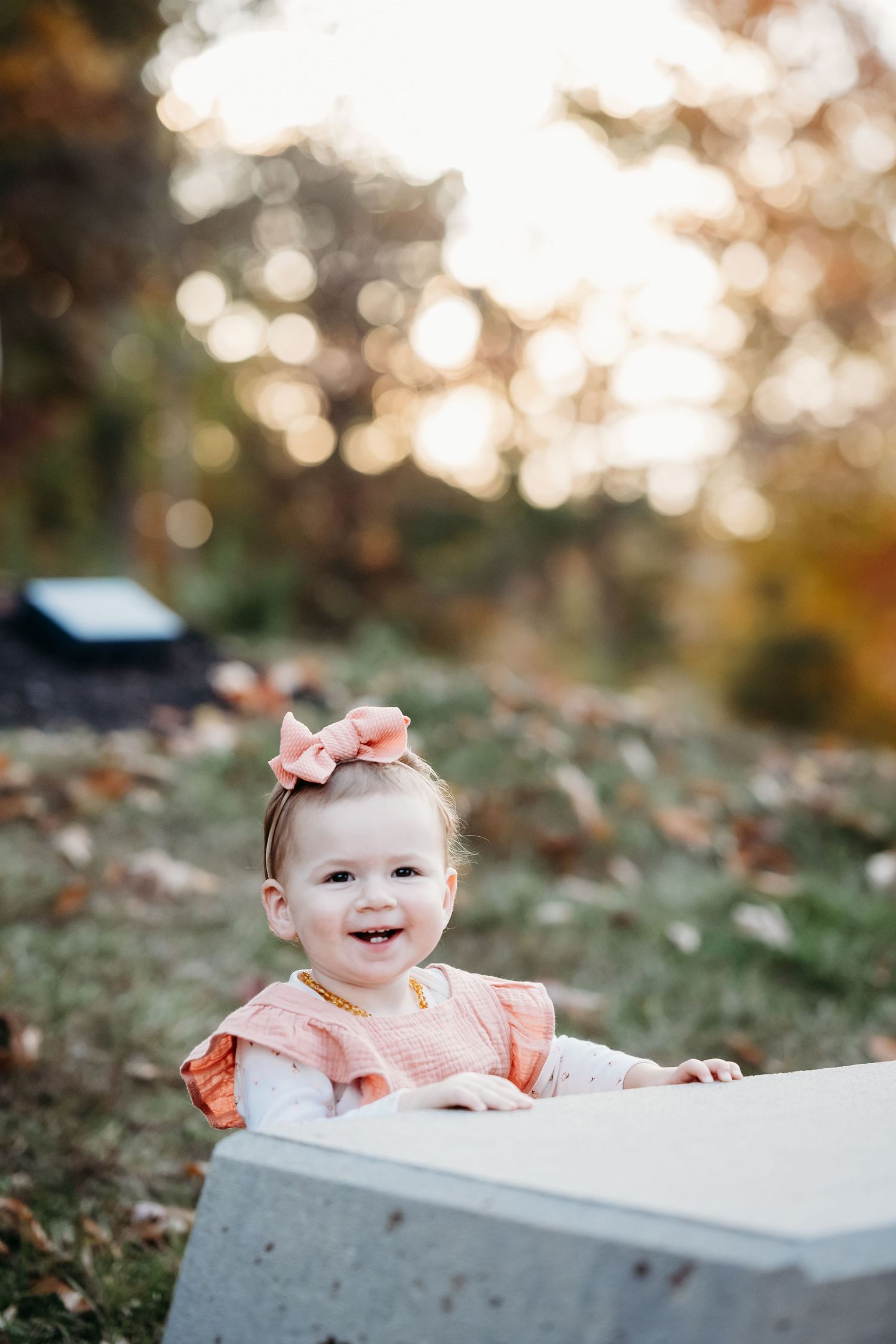 Sweet baby portrait on white surface with soft bokeh background.