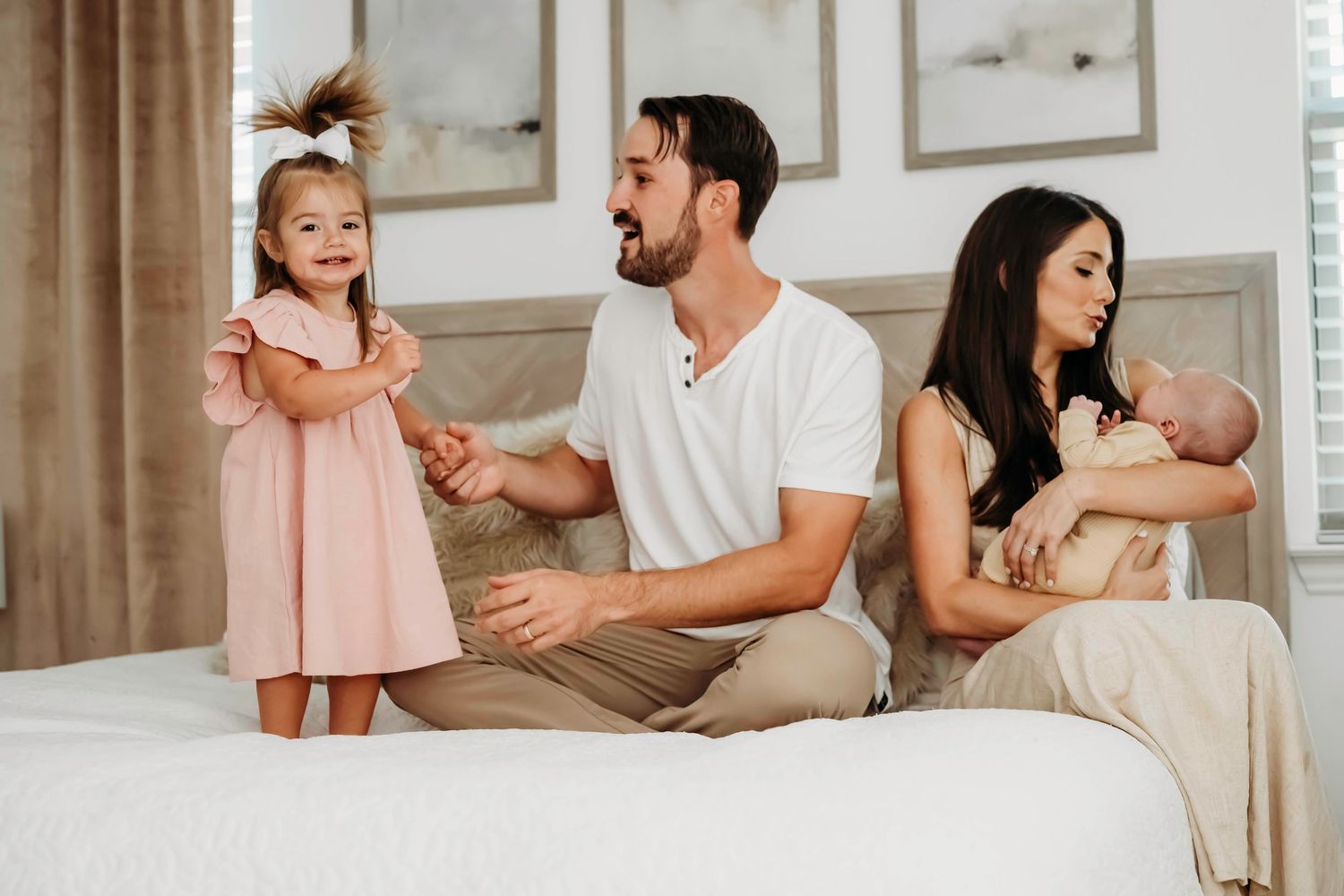 Family spending quality time together on a couch in a bright living room with natural light.