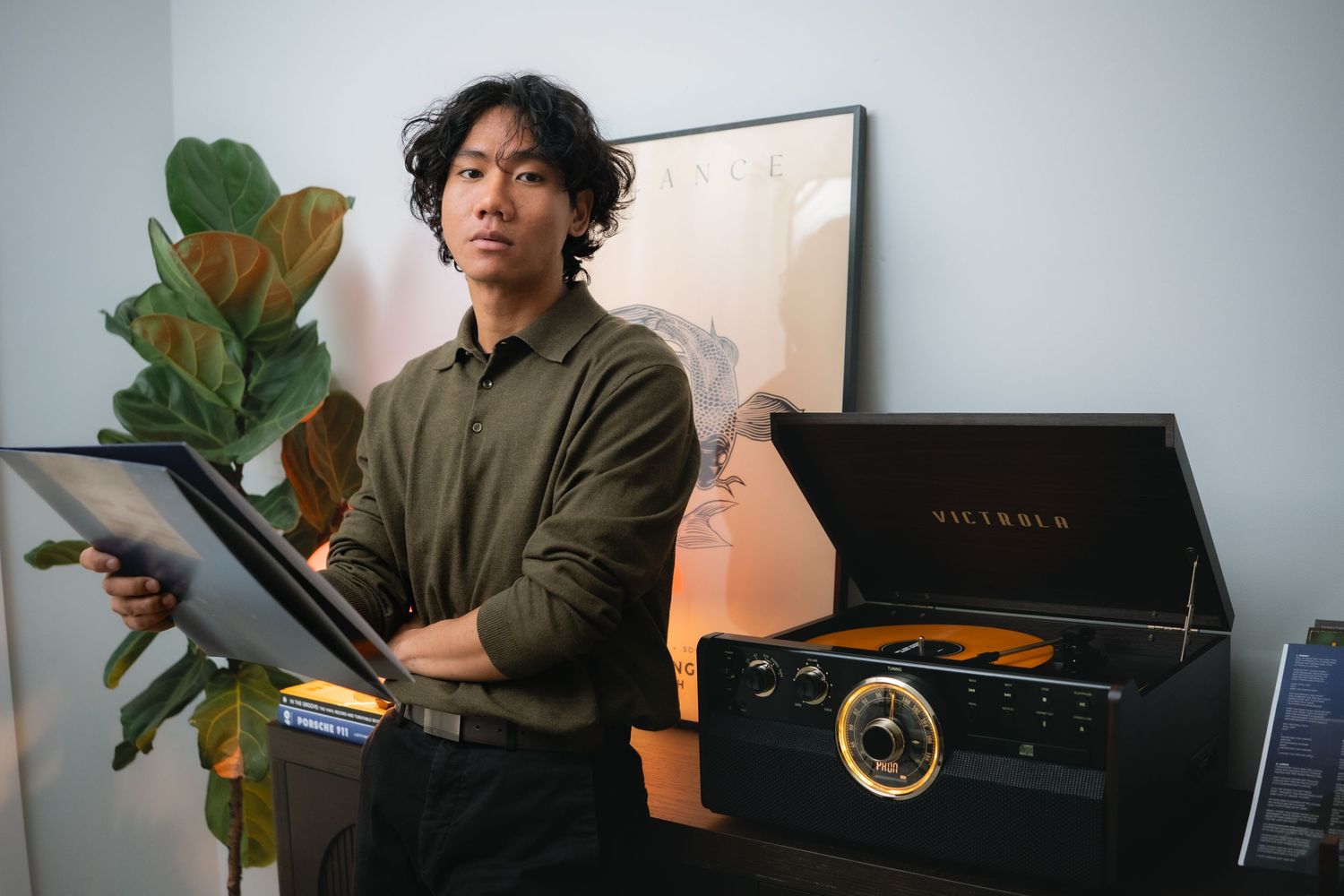 Creative workspace scene with vinyl record player and indoor plants.