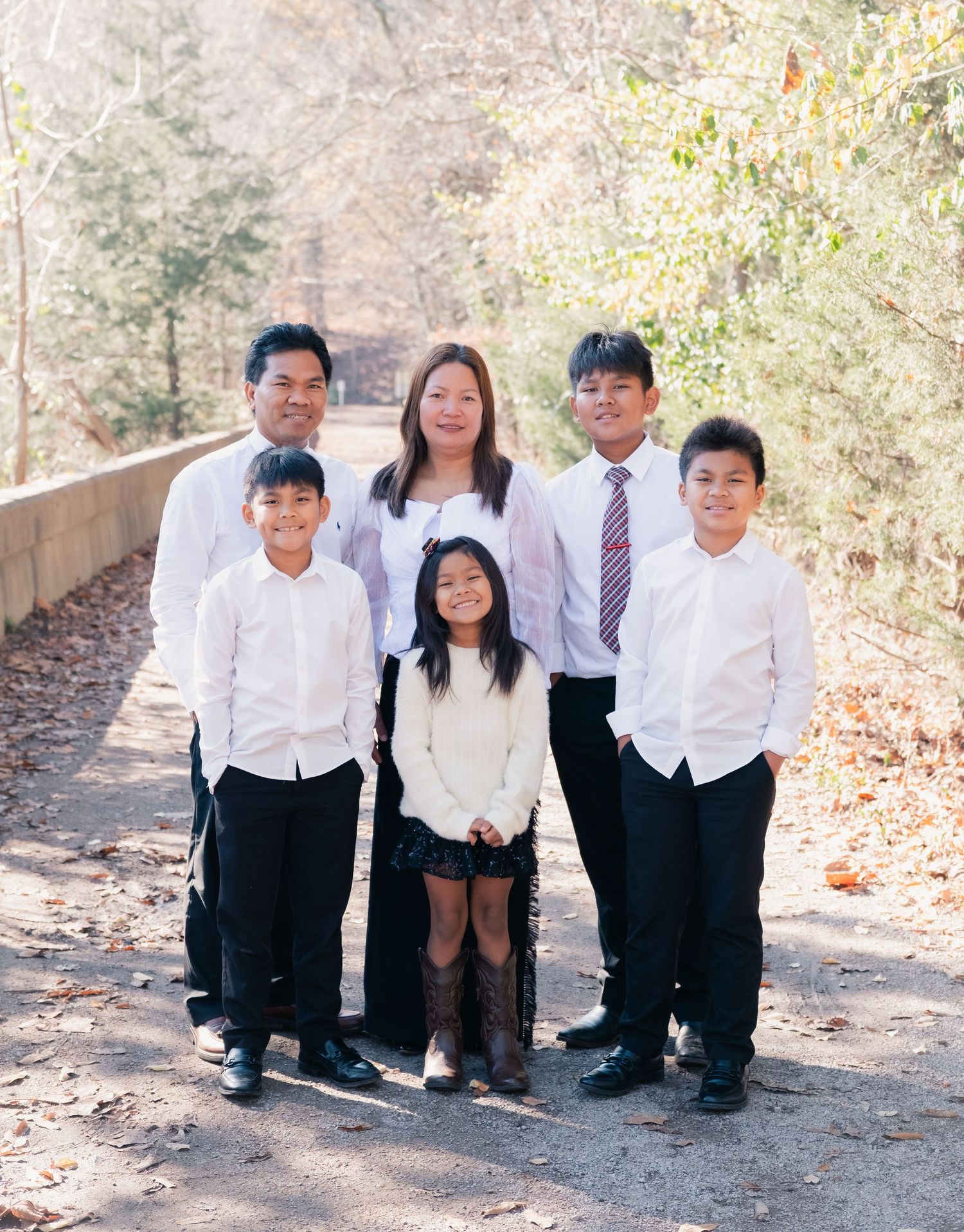 Casual group portrait taken outdoors on a sunny autumn day.