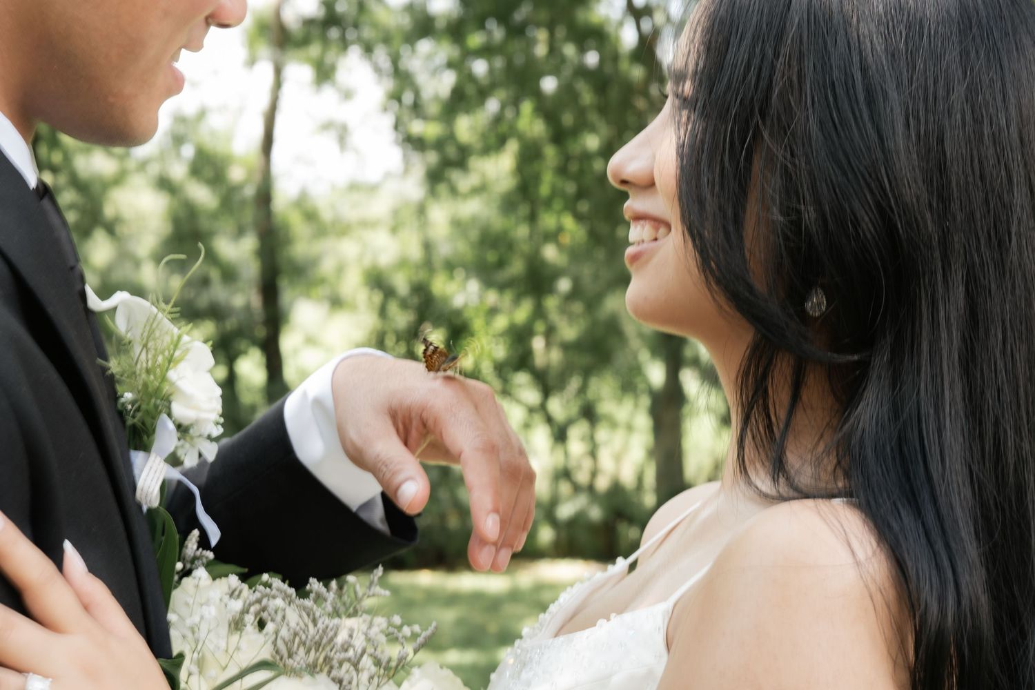Candid outdoor wedding portraits showing joyful moments between the couple.