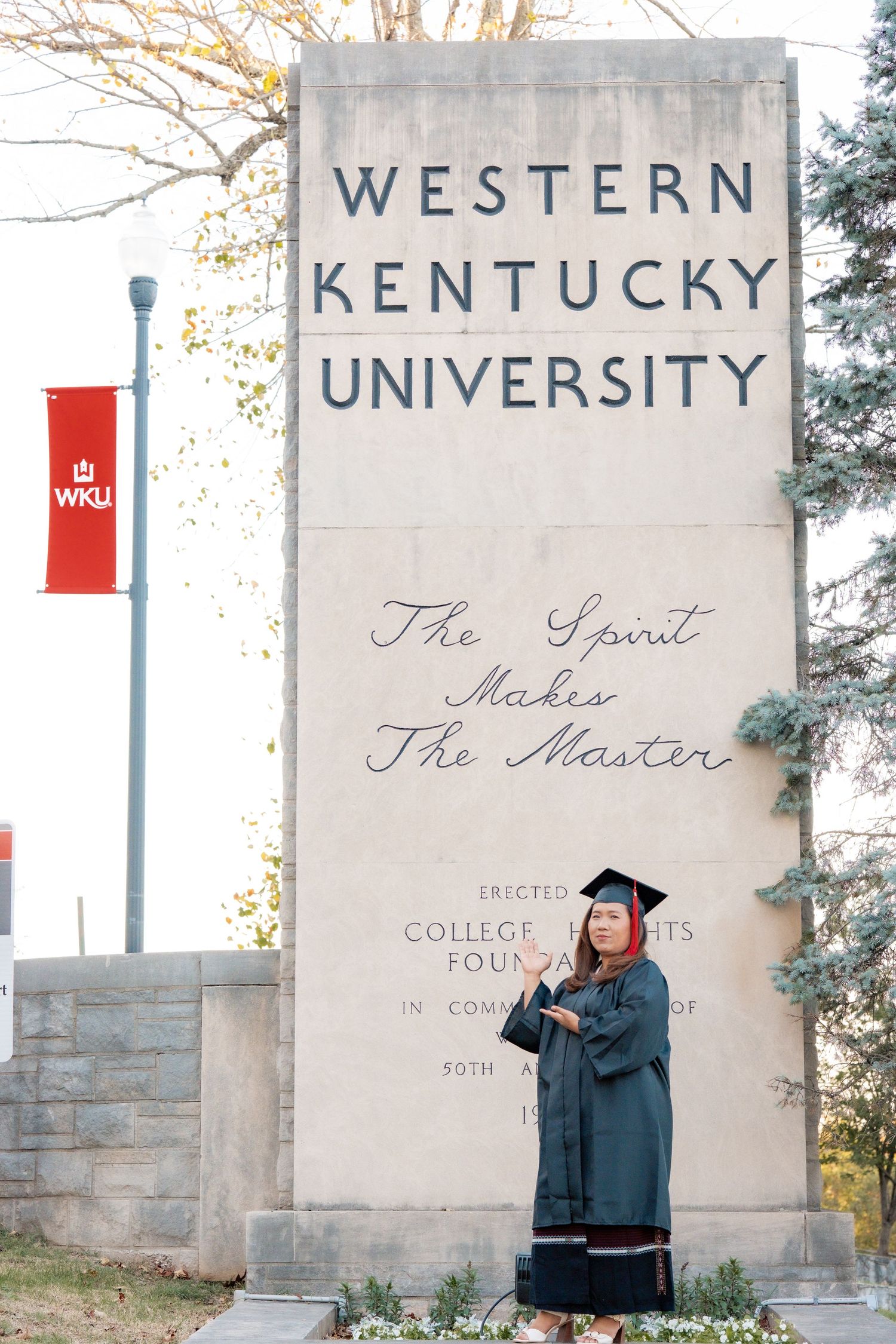 Series of graduation photos taken at Western Kentucky University stone entrance markers.